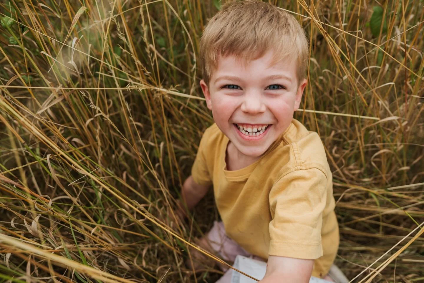 Real smiles brought on by real fun.

This photograph came about from a family game of hide and seek in a field next to their house. One of the kids favourite games.

I don&rsquo;t ask children to stop and smile for the camera - I like to capture thei