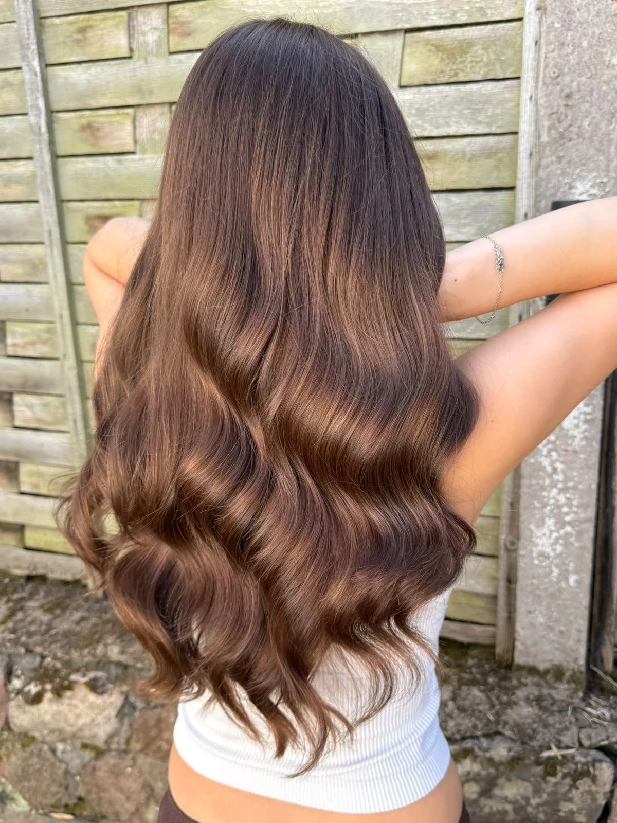 Glossy bouncy blow dry on long chocolate brown hair by Emillio at Bonomini, Bristol