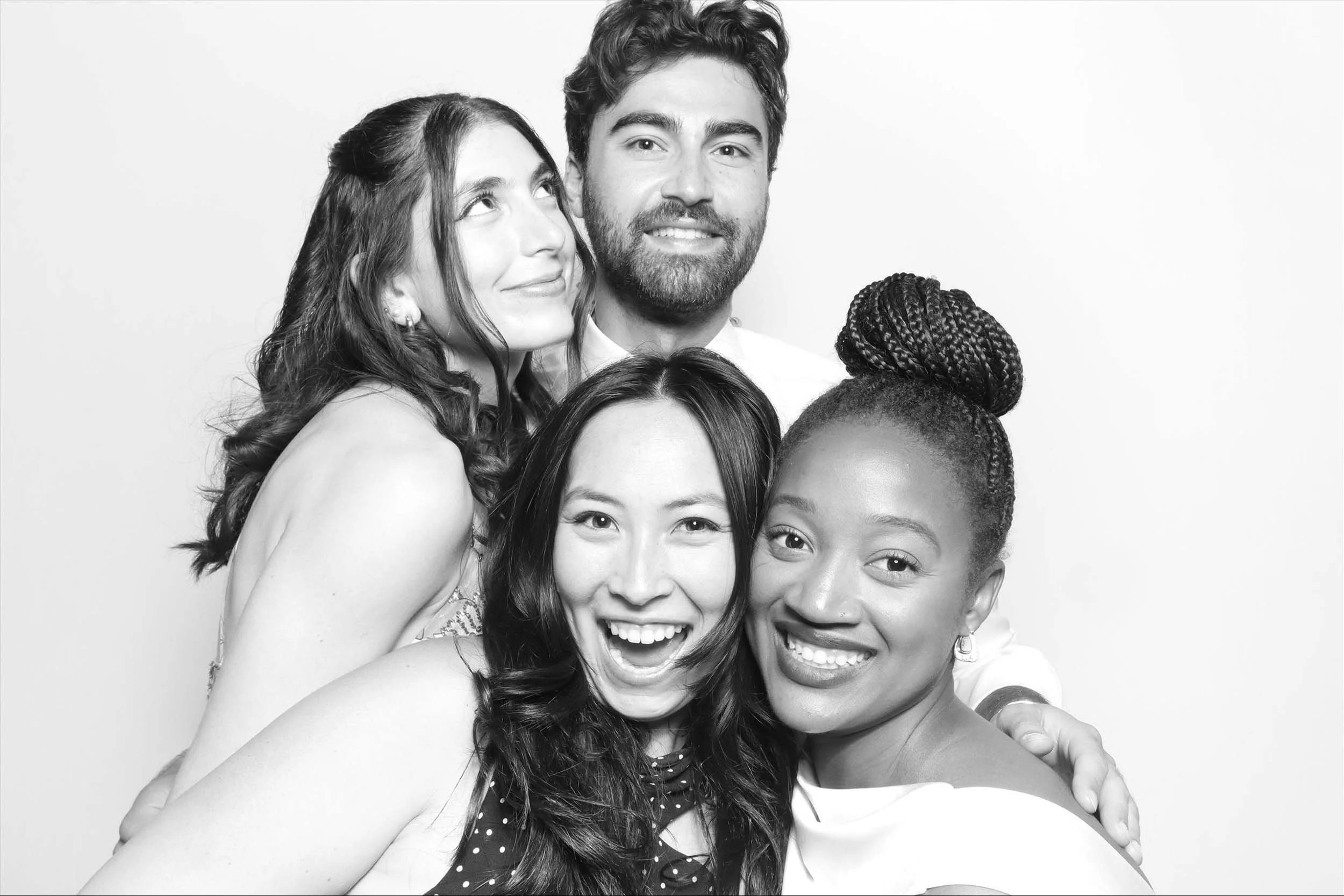 group of friends enjoying Photique's photo booth in Naperville, IL