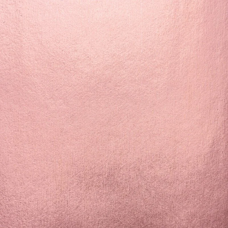 Textured pink backdrop.