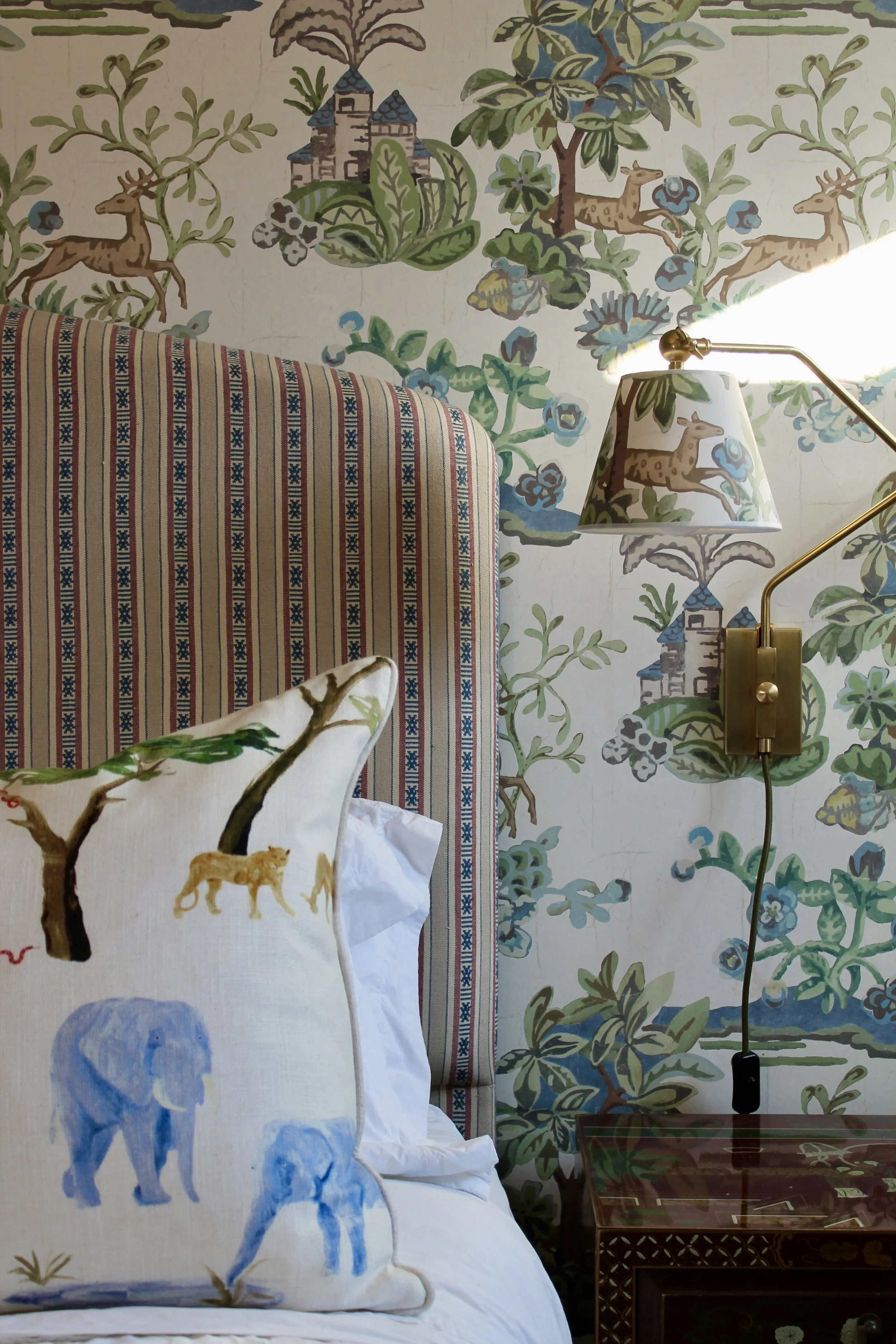 Bespoke silk headboard with custom wallpaper lampshade