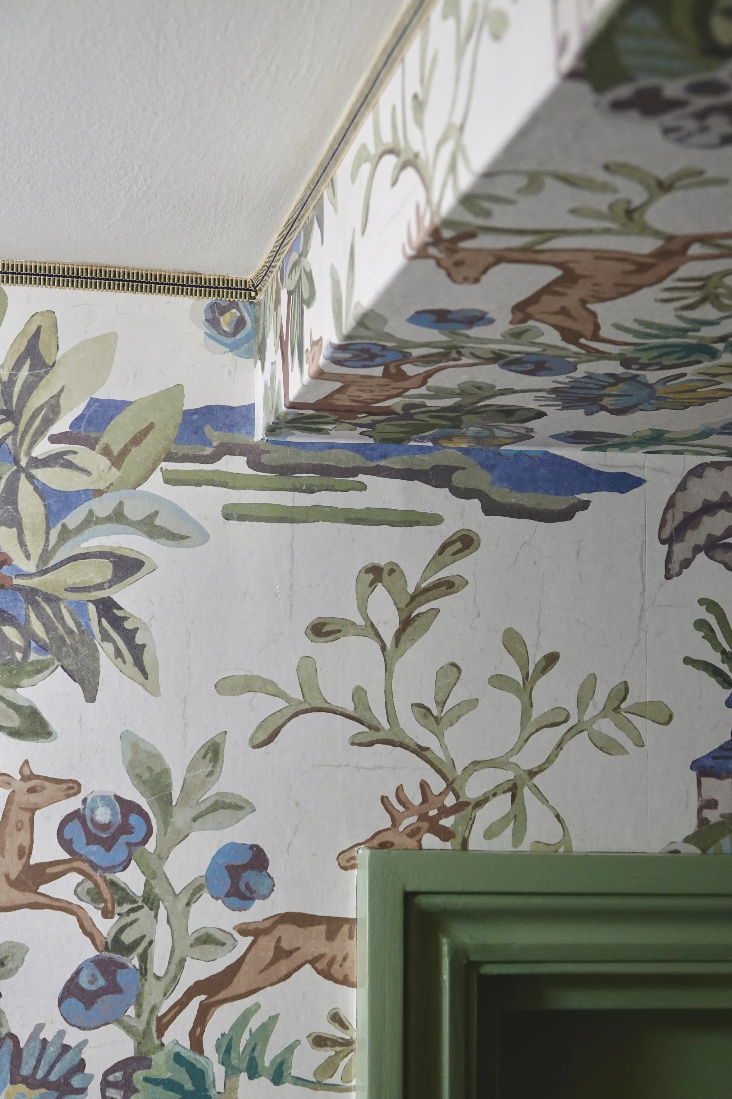 Braid trim to neatly join the wallpaper to the ceiling