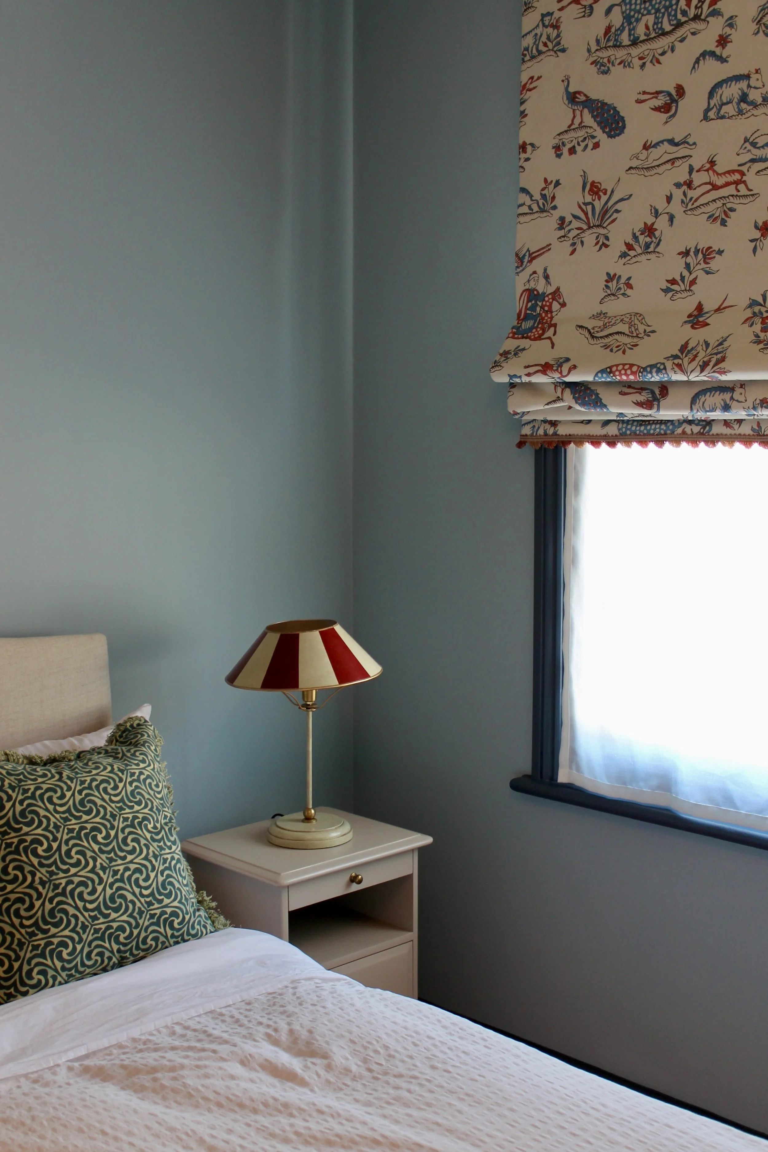 Spare bedroom repainted;, custom blinds, pelmets and cafe curtains added