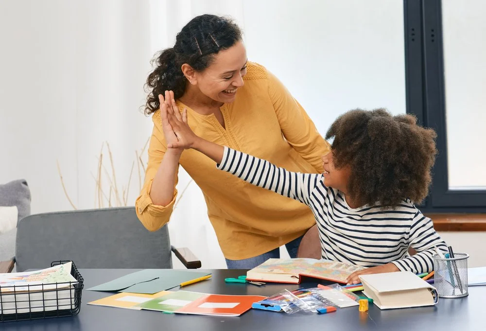 woman using effective ABA therapy techniques with young girl