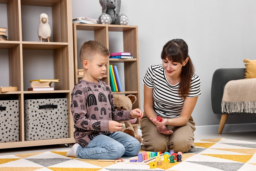woman implementing ABA techniques for child