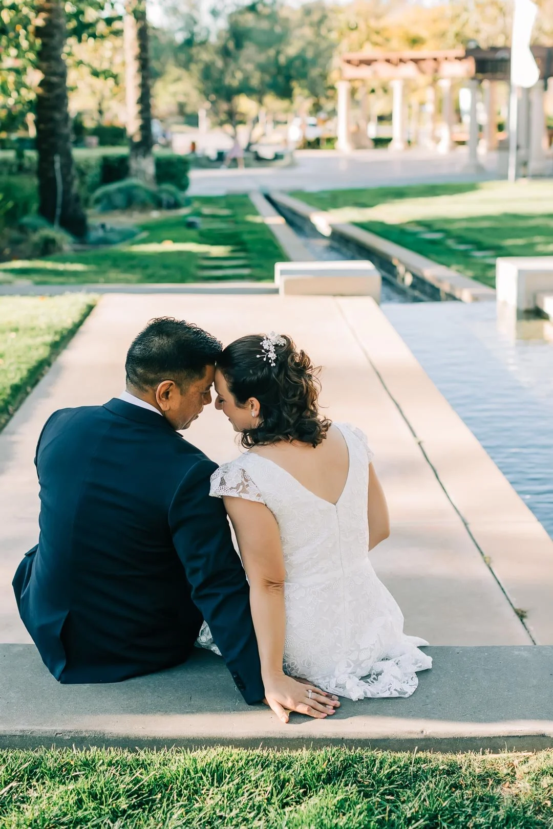 San Diego Wedding Photographer, Christel Tran, photographing the bride and groom