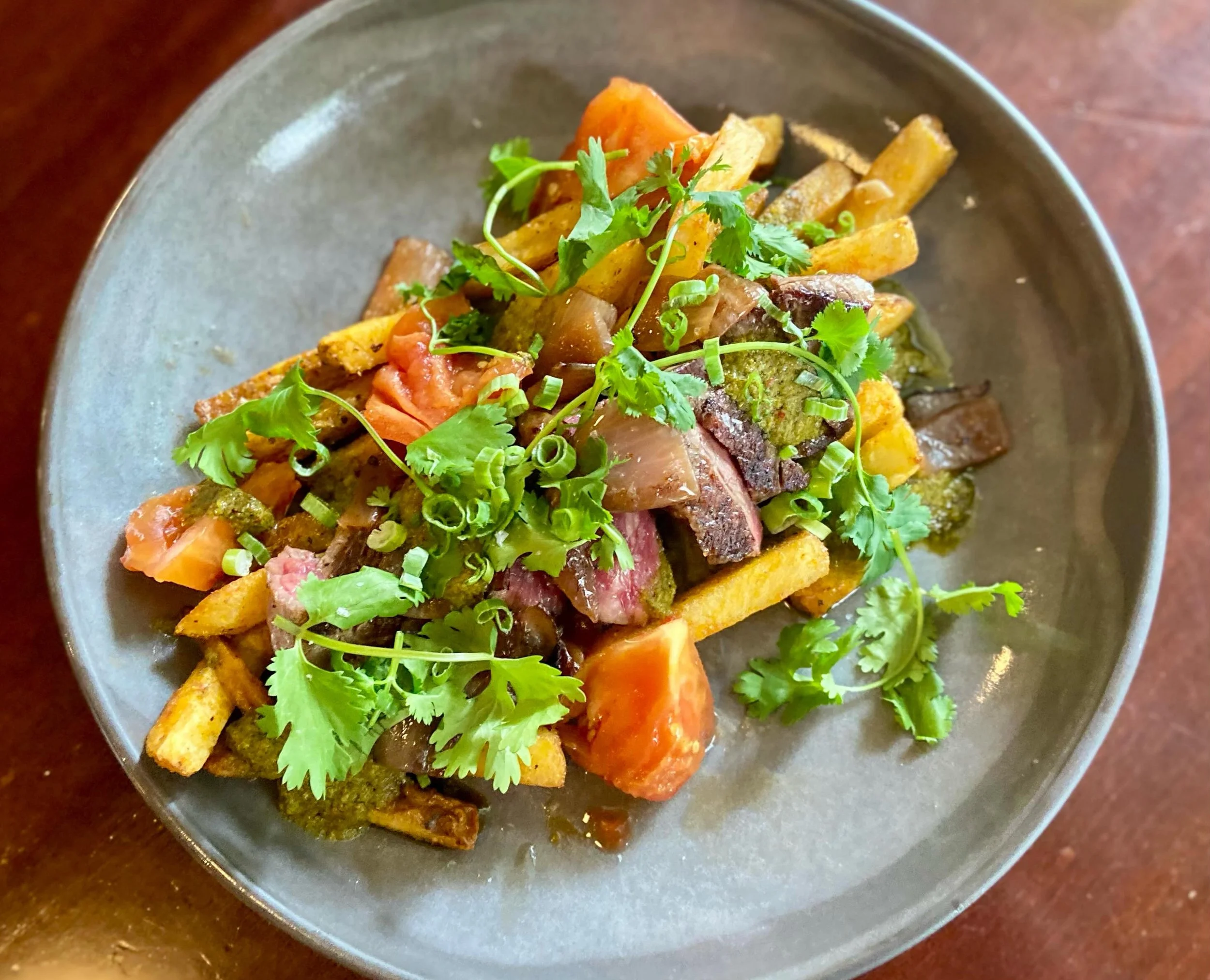 Need more of a reason to stop in for brunch today?
How about this Peruvian-inspired dish:

WAGYU FLANK STEAK
&bull;adobo seasoned fries
&bull;charred red onion
&bull;soy pickled tomato 
&bull;house chimichurri
&bull;cilantro

We&rsquo;re excited and 