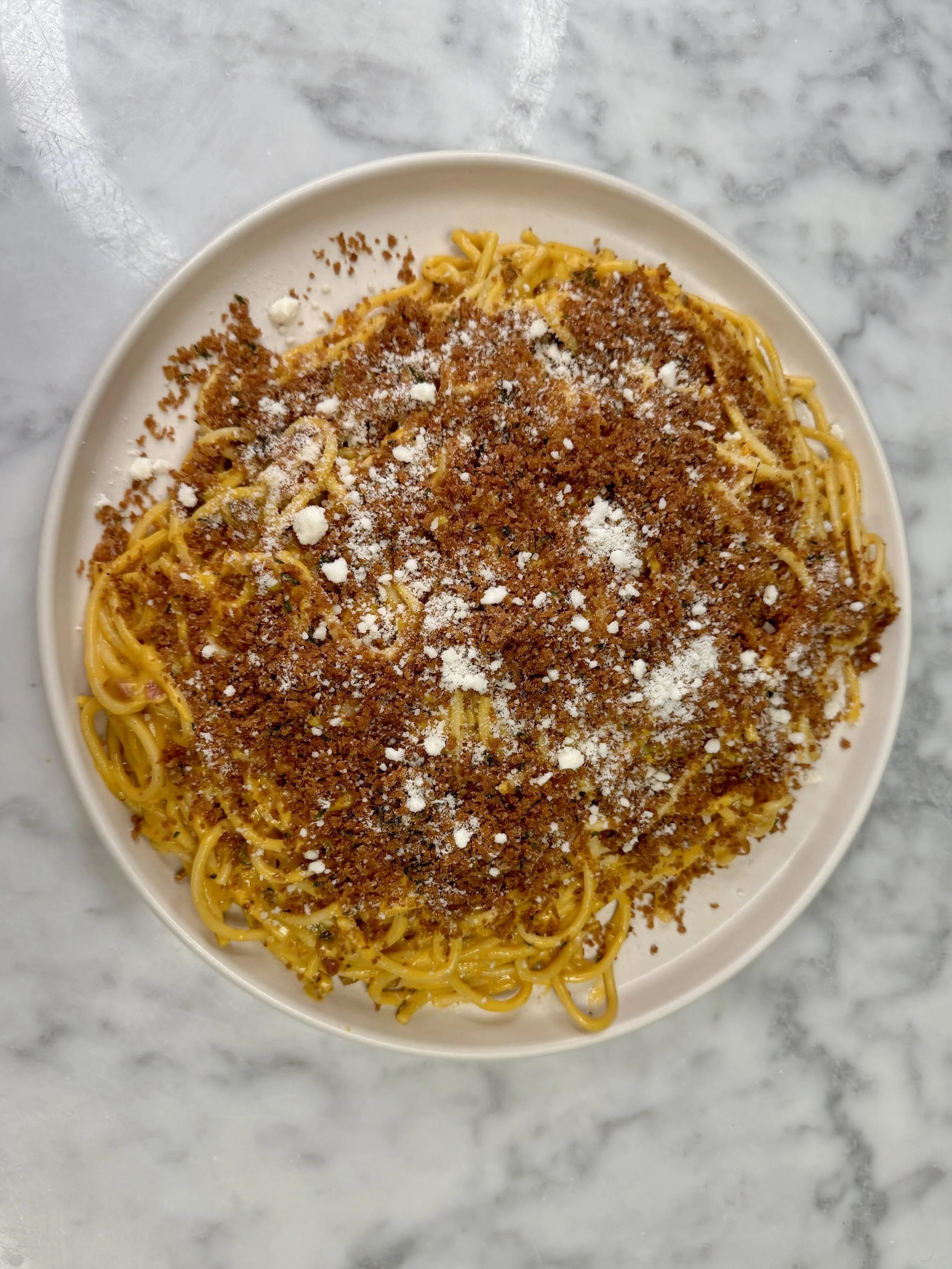Honeynut squash carbonara with bucatini, guanciale, and herbed breadcrumbs