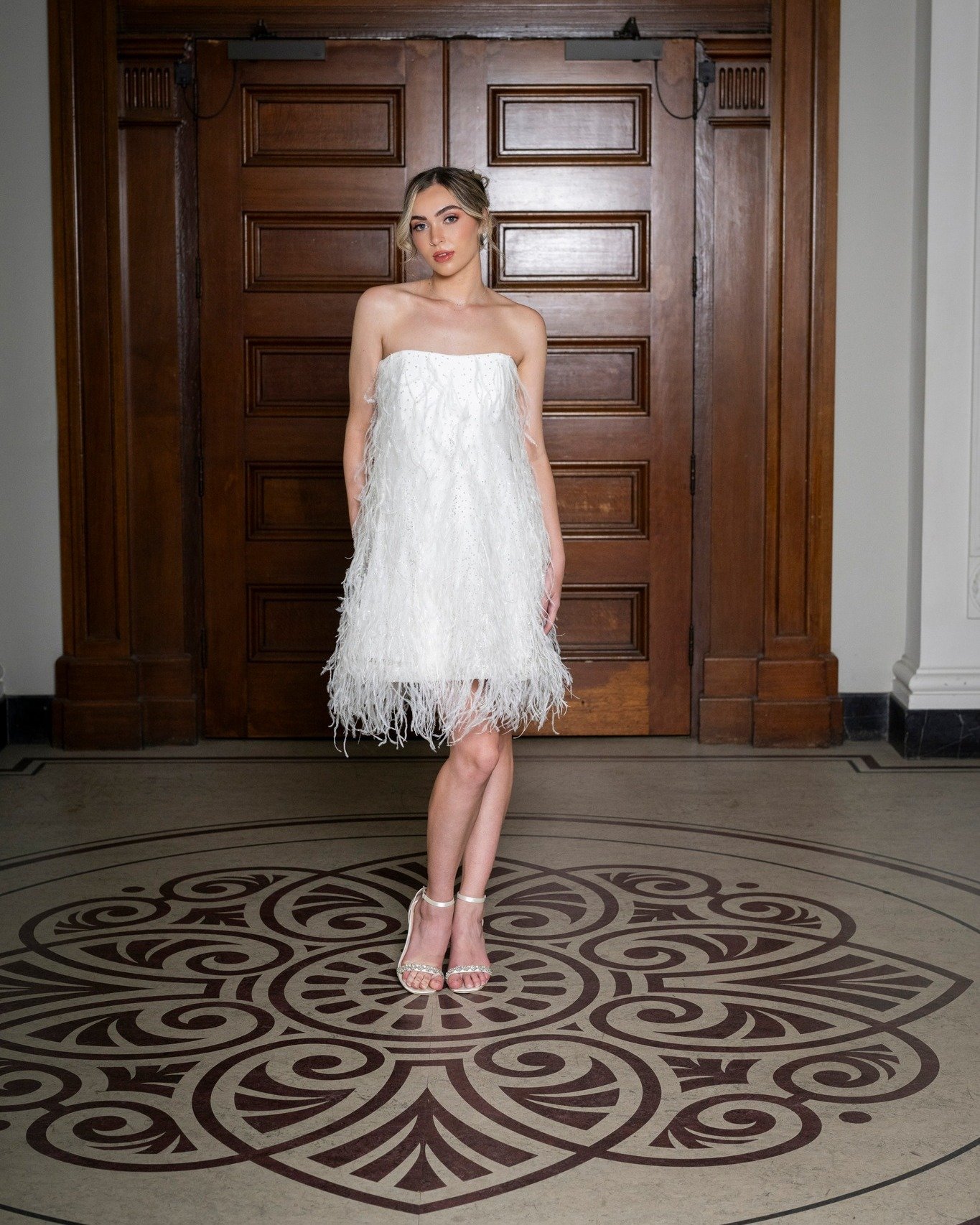 Planning an elopement or looking for a reception party dress? The Jami Mini Dress is made for fun with its beautiful feathers and sequin detailing. Book an appointment to try it on now.
.
.
Photographer @kym_burmester
H&amp;MU @thehairandmakeupartist