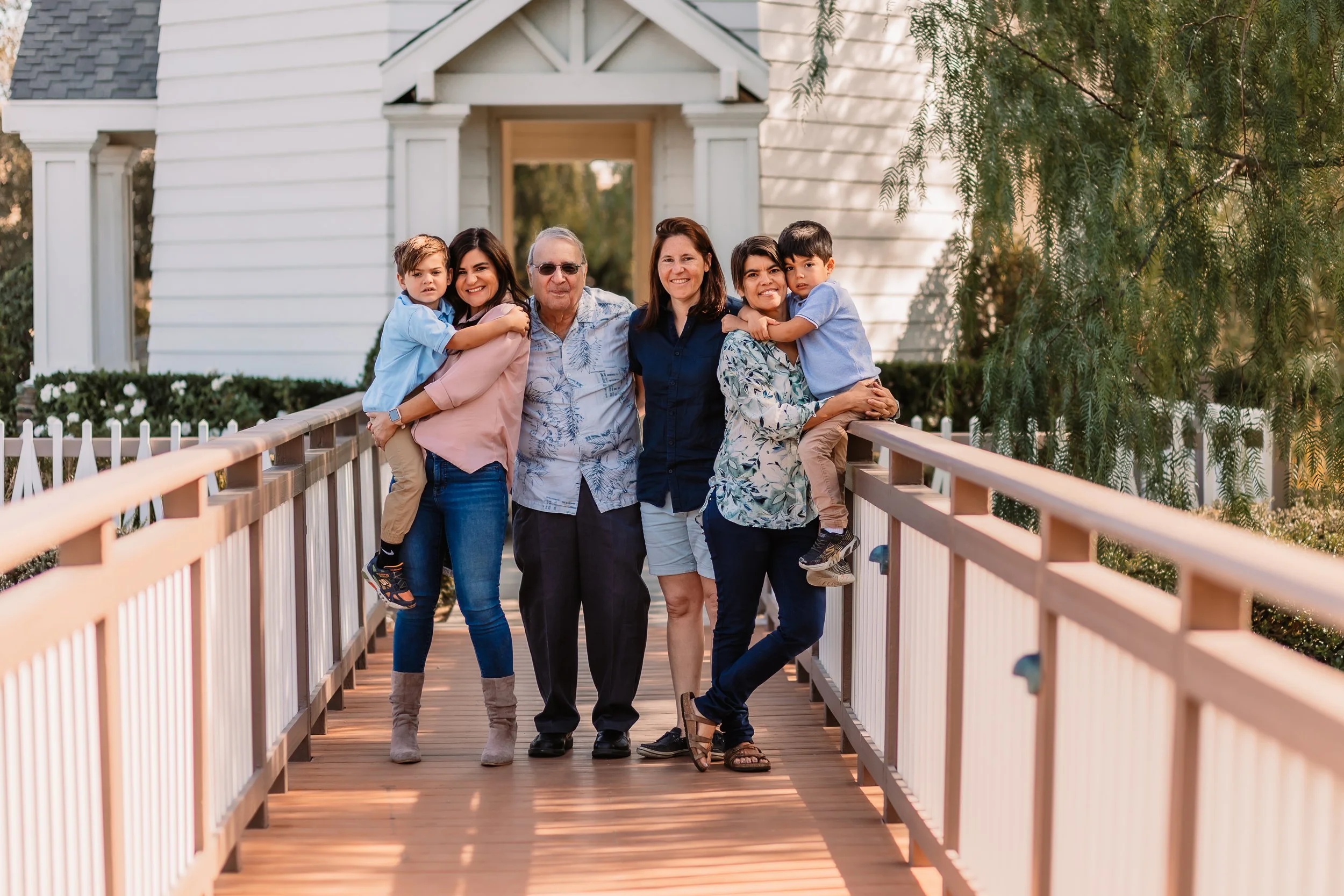 Three generations, grandparents holding their grandsons, on the bridge at Bridgeport in Santa Clarita.