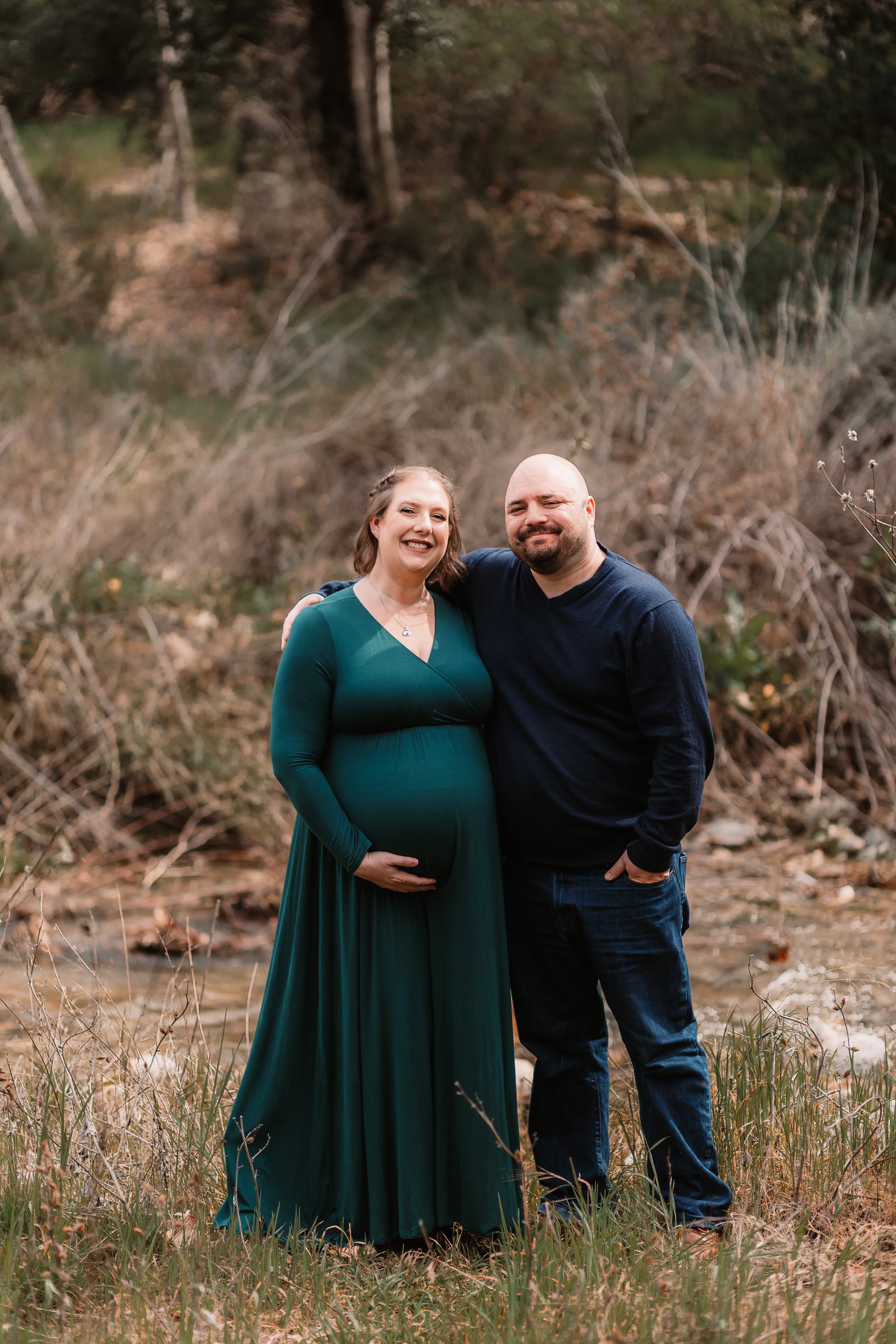 Pregnant mother in green dress at Placerita Canyon, Santa Clarita maternity photographer