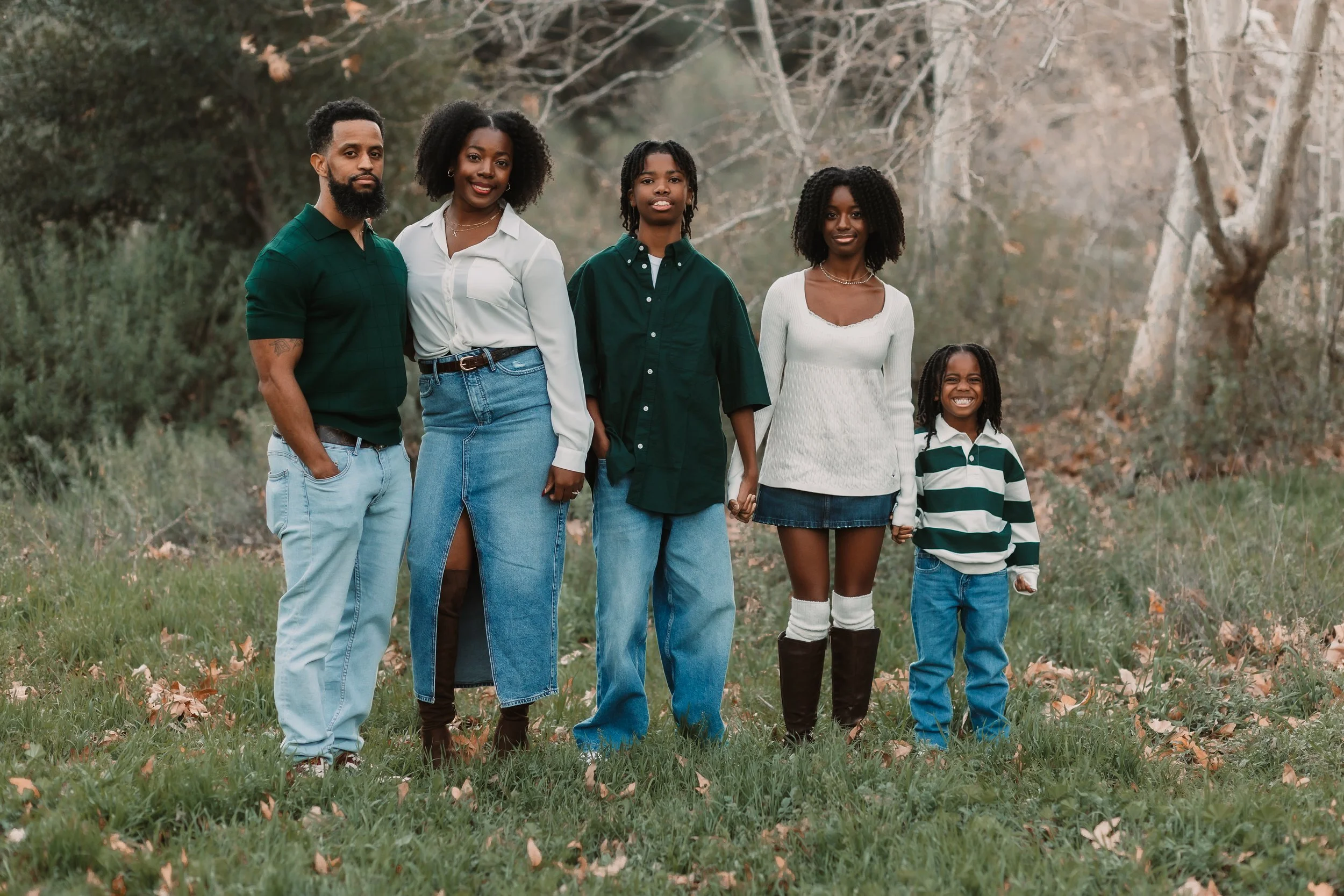 Family of five standing among fallen oak logs at Placerita Canyon, Santa Clarita family photographer