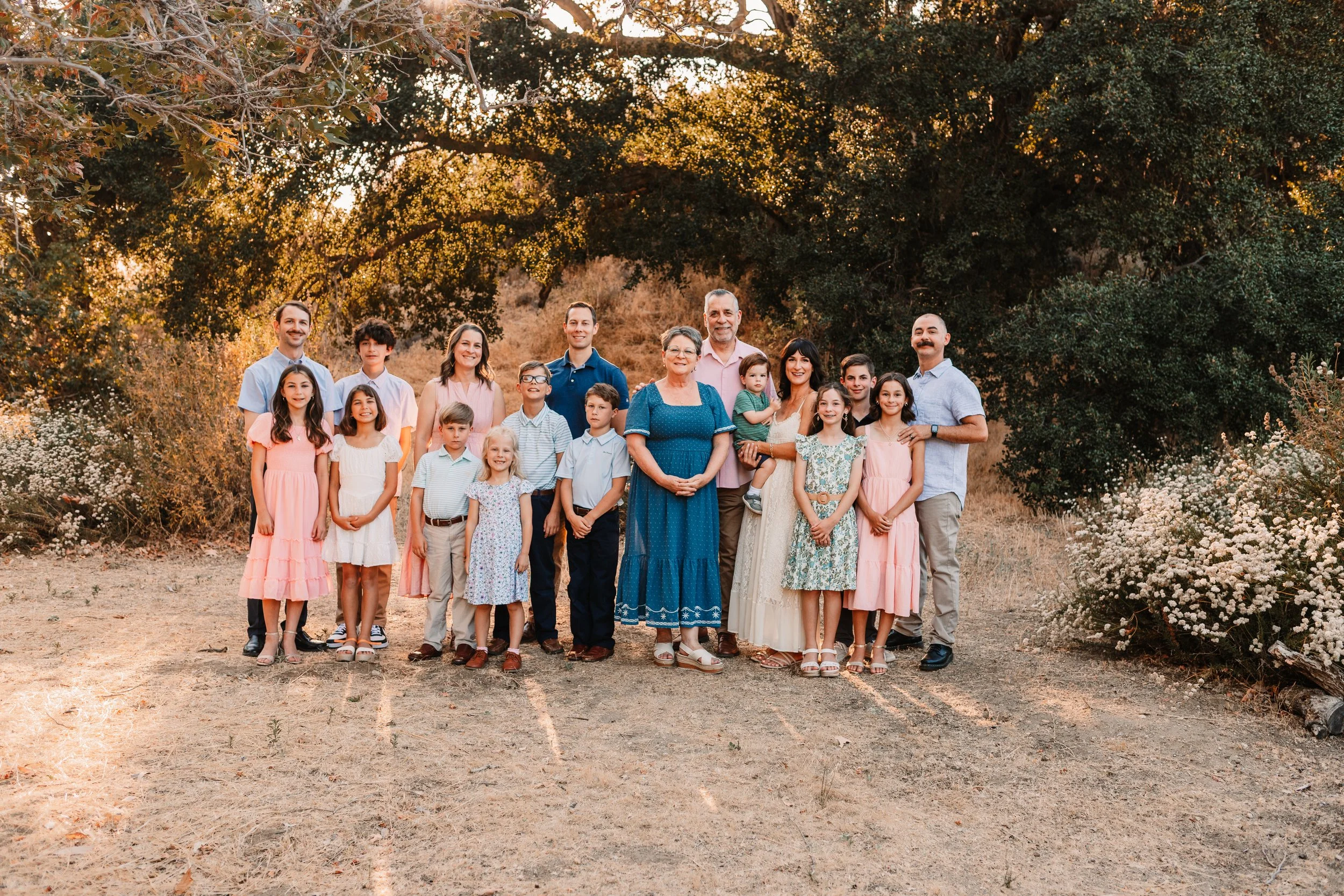 Large extended family posed together at golden hour in Santa Clarita