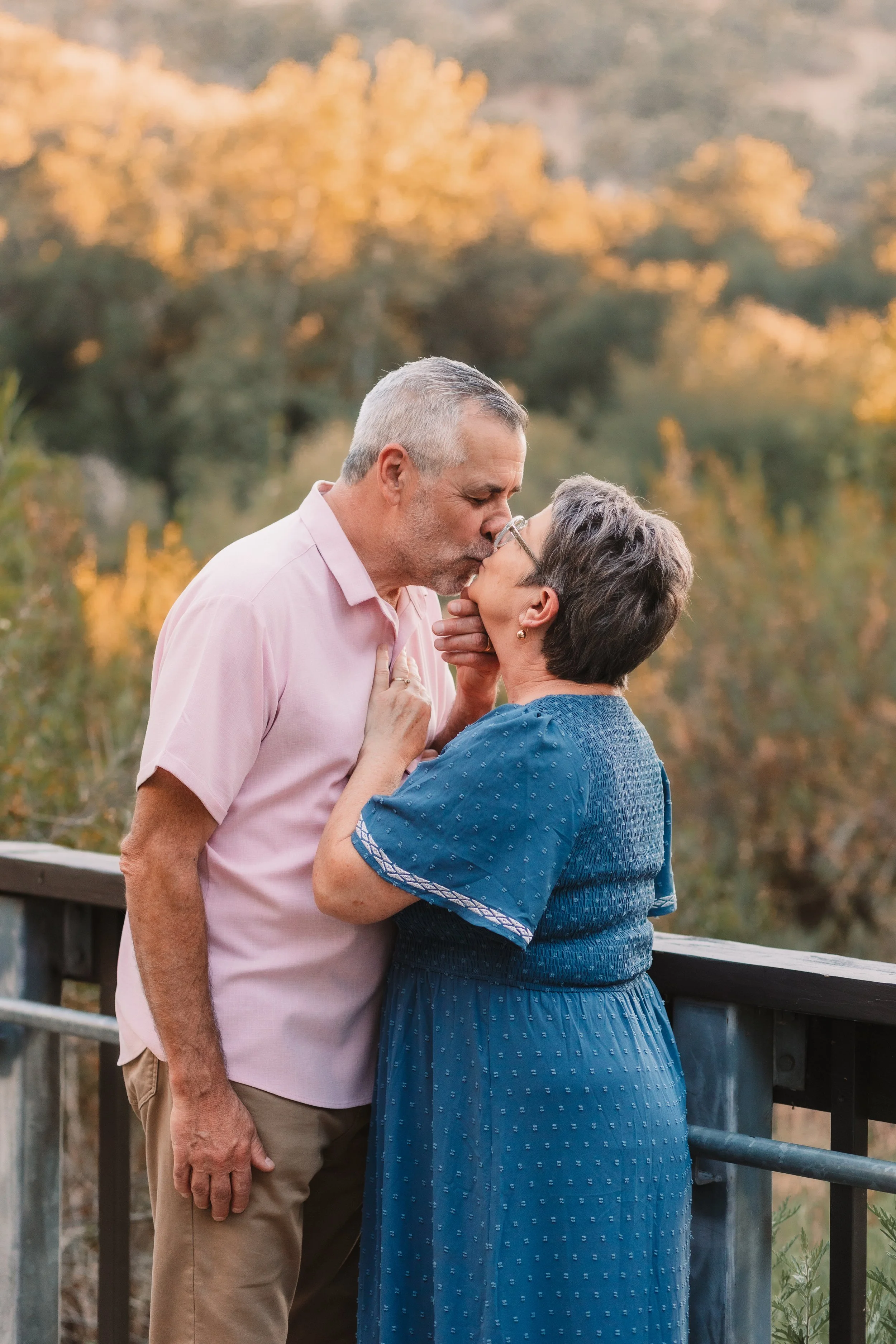 Couple sharing a kiss during a family photo session at Placerita Canyon, Santa Clarita family photographer