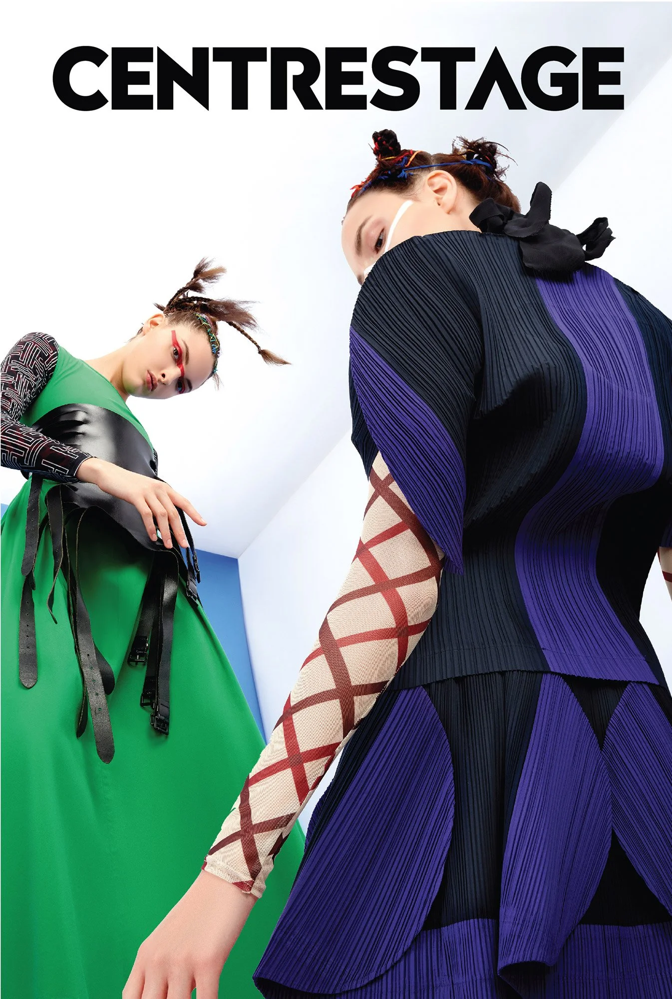 Two fashionably dressed models in avant-garde outfits pose against a white and blue background with the logo 'CentreStage' at the top.