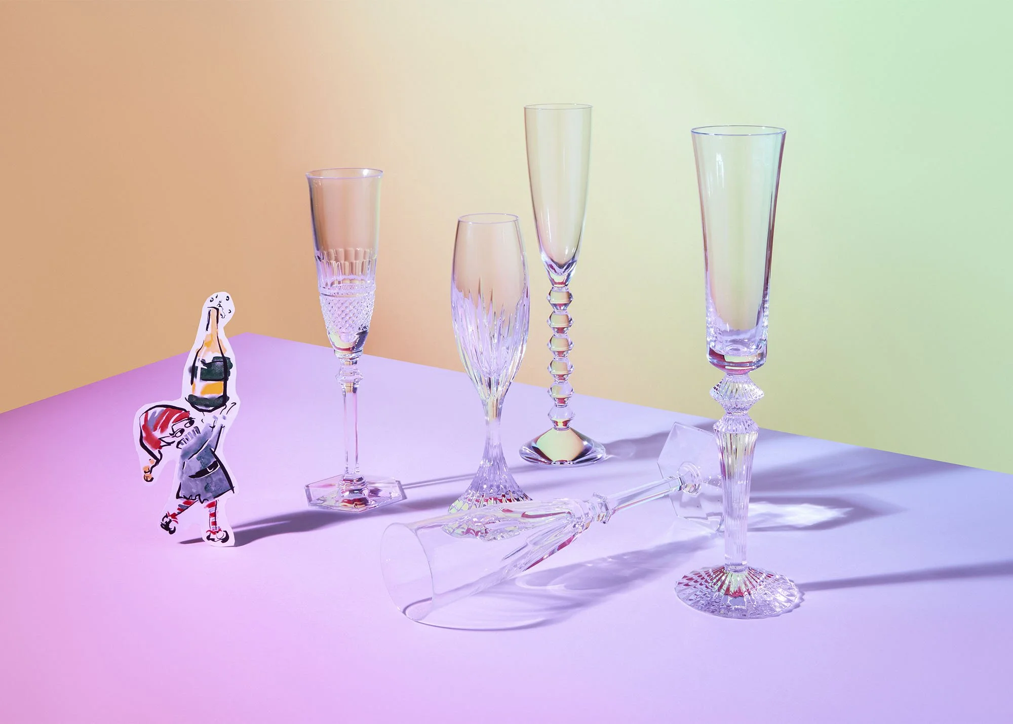 Colorful background with five empty crystal champagne flutes on a pastel table, with a small illustrated girl holding a camera standing beside them.