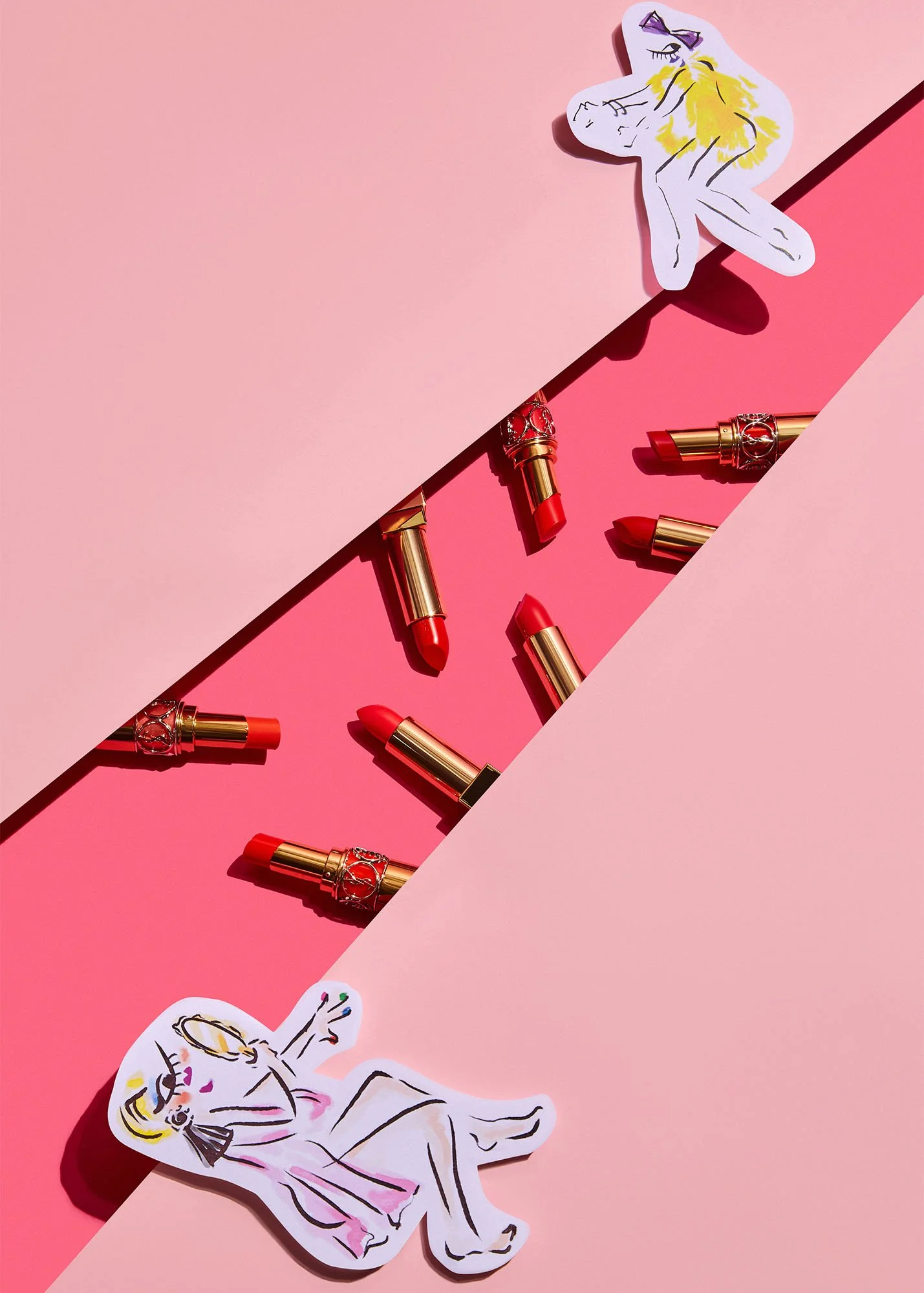 Assorted red lipstick tubes with gold accents scattered on a pink background with black divider, featuring illustrations of lounging women cutouts with blonde hair and sunglasses.