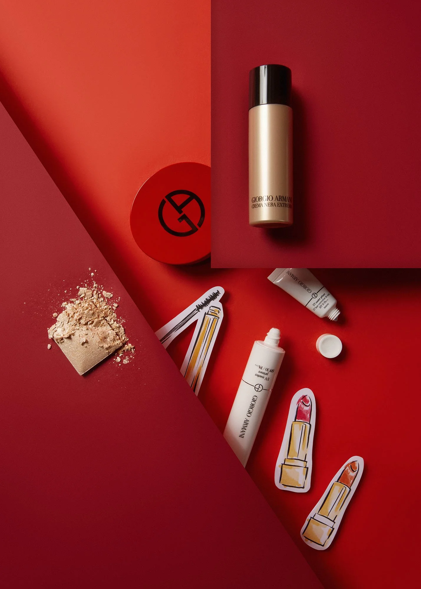 Flat lay of makeup and skincare products on a red background, including a Giorgio Armani foundation stick, powder compact, a white tube, and illustrated lipstick stickers.