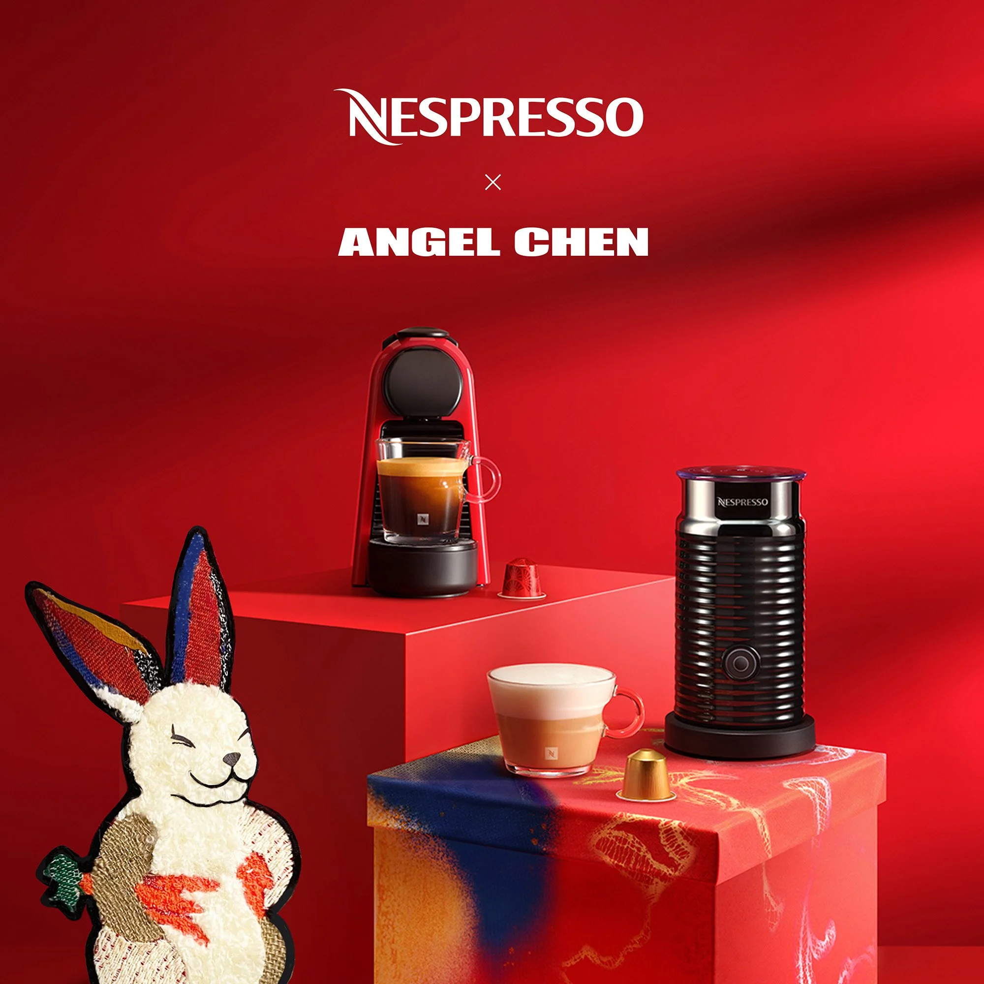 A promotional image showing Nespresso coffee machines and cups on red and multicolored platforms with a red background, featuring a cute embroidered bunny character in the front.