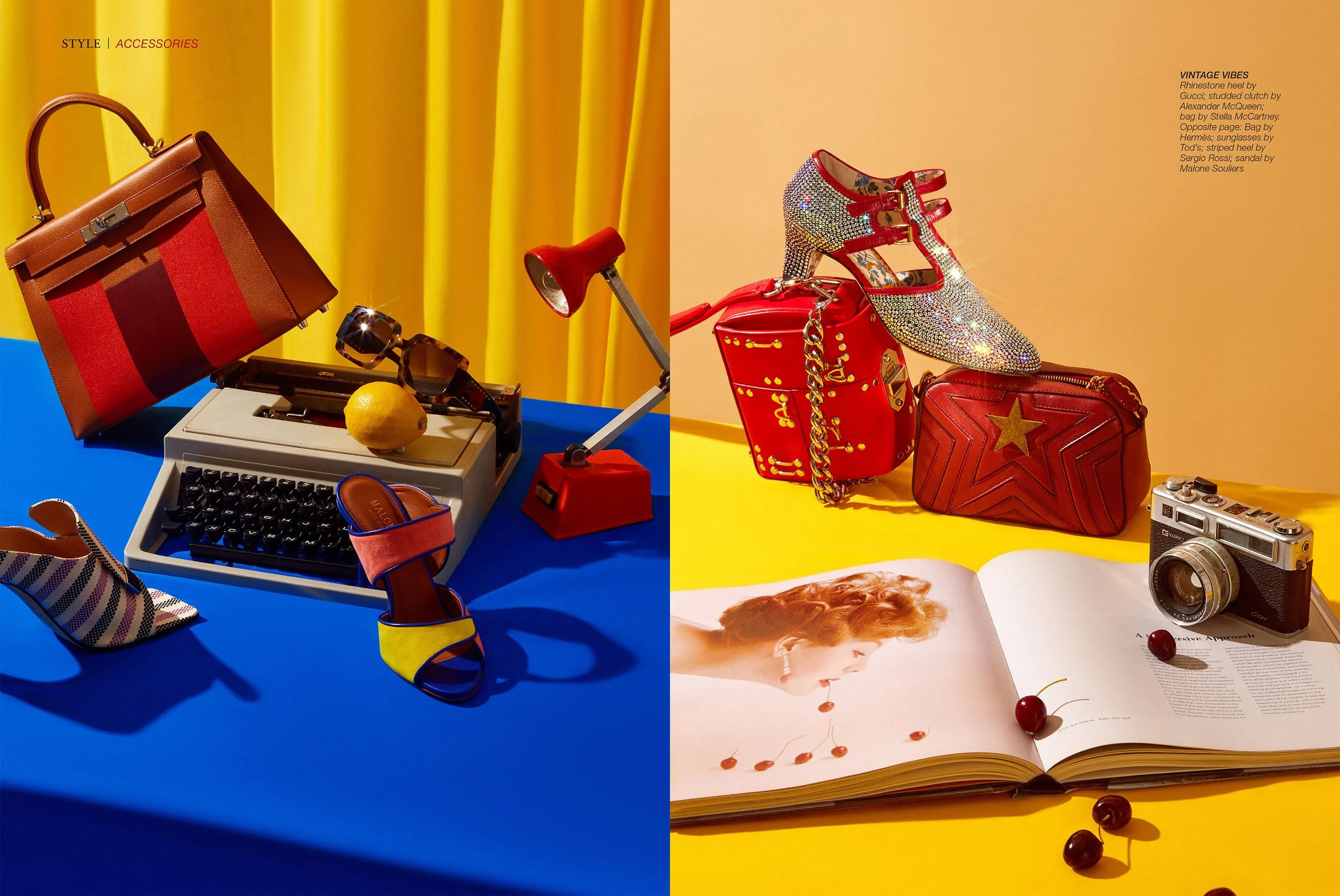 Colorful still life of fashion accessories, including handbags, shoes, sunglasses, and a vintage camera, arranged on vibrant blue and yellow surfaces with bright background curtains