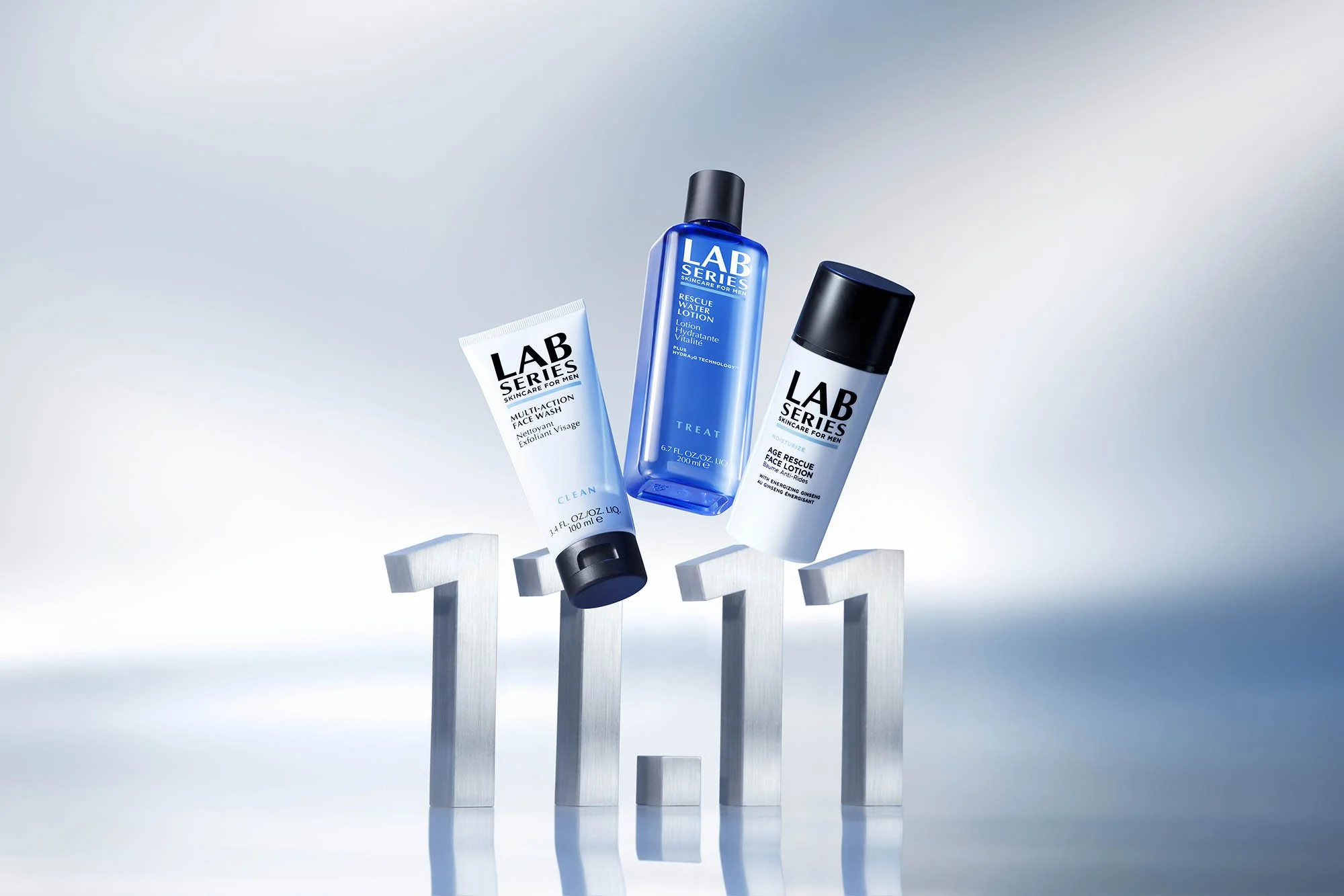 Three skincare products from Lab Series are positioned on metallic number 11, with a modern gradient background.