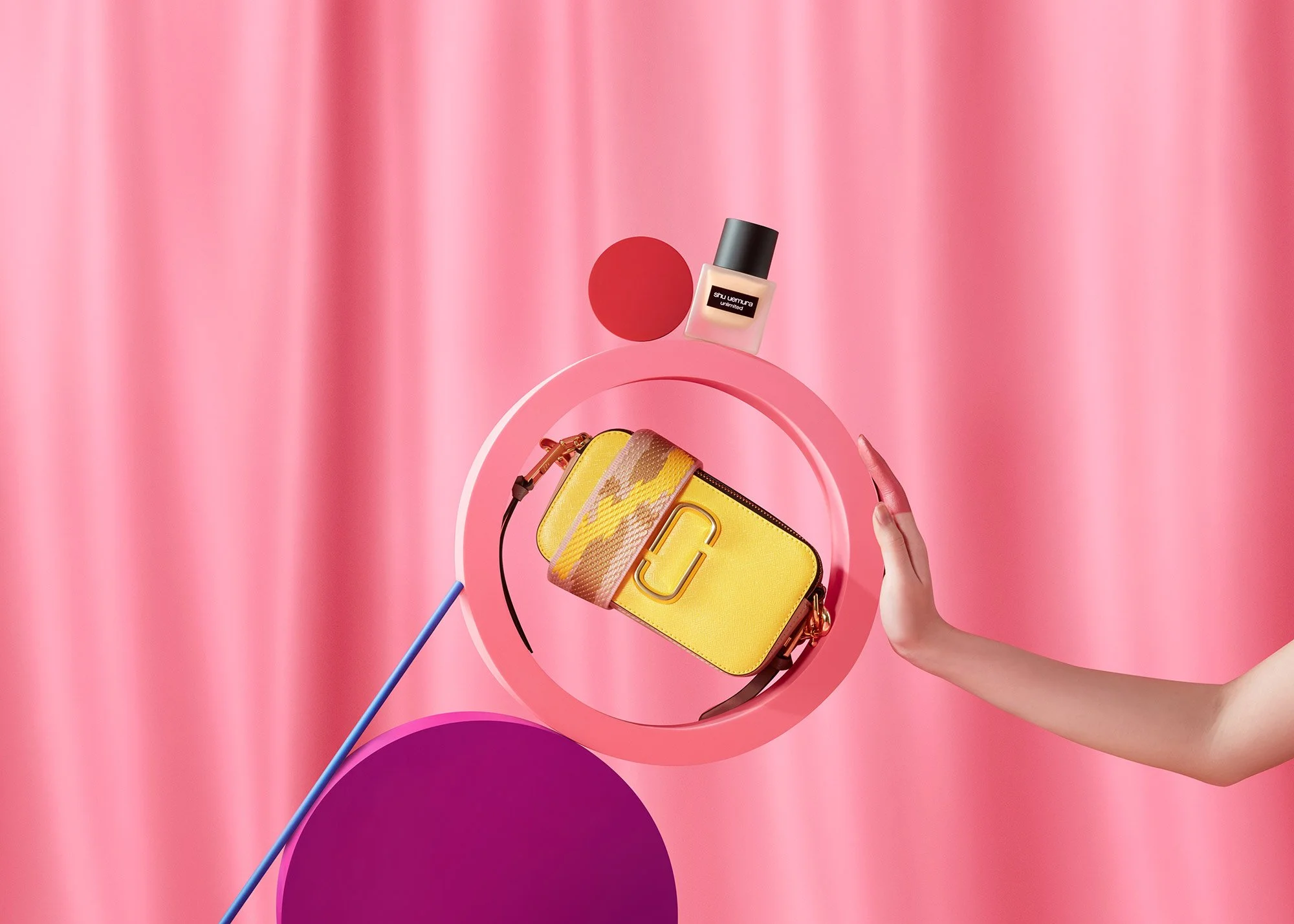 A colorful, abstract background with a pink curtain, a yellow handbag, a bottle of nail polish, and a pink and purple circle, with a hand reaching towards the handbag.