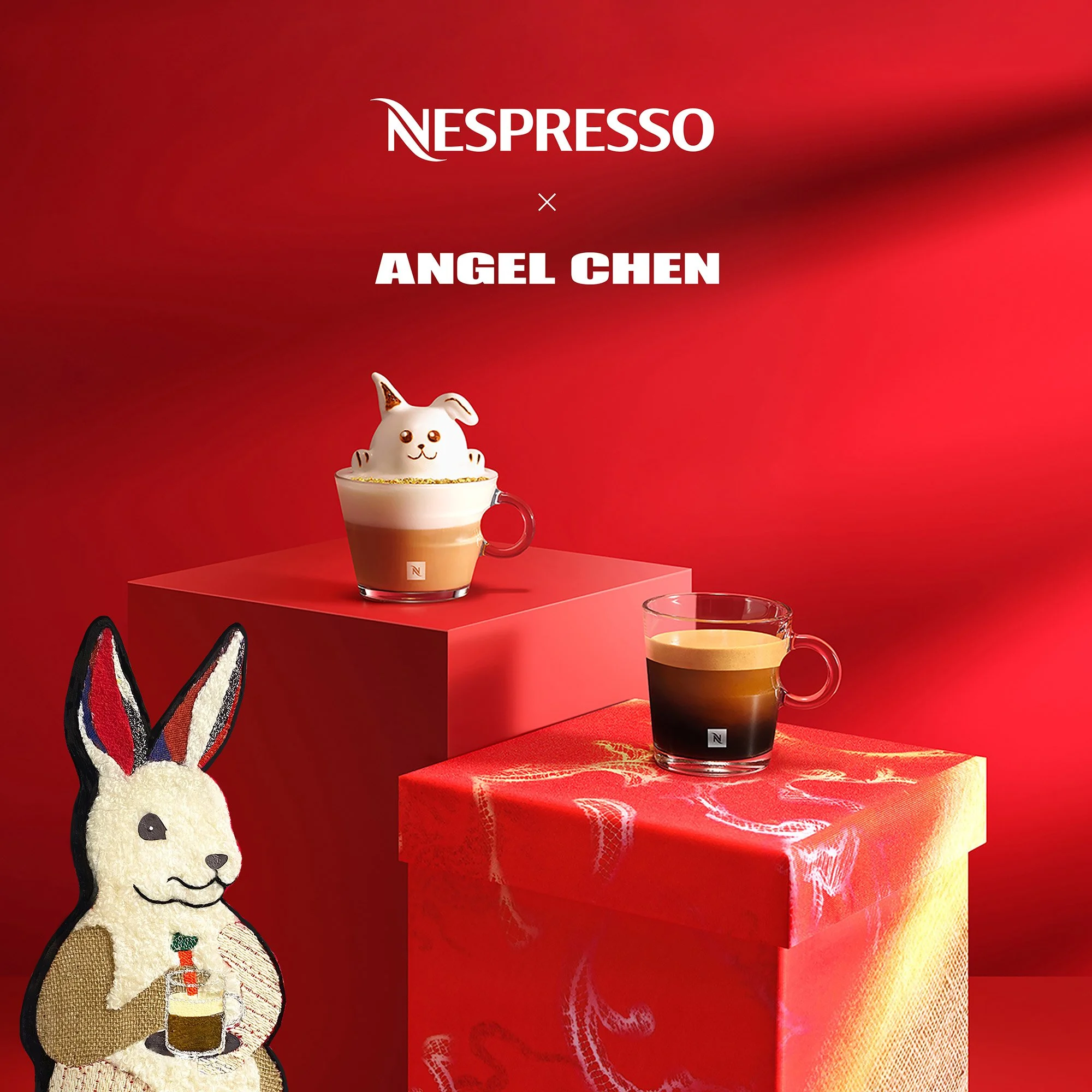 Two glass cups with coffee drinks on red and pink pedestals, a white bunny cake with a unicorn horn, and a bunny plush toy holding a drink, all set against a red background with the text 'Nespresso x Angel Chen'.