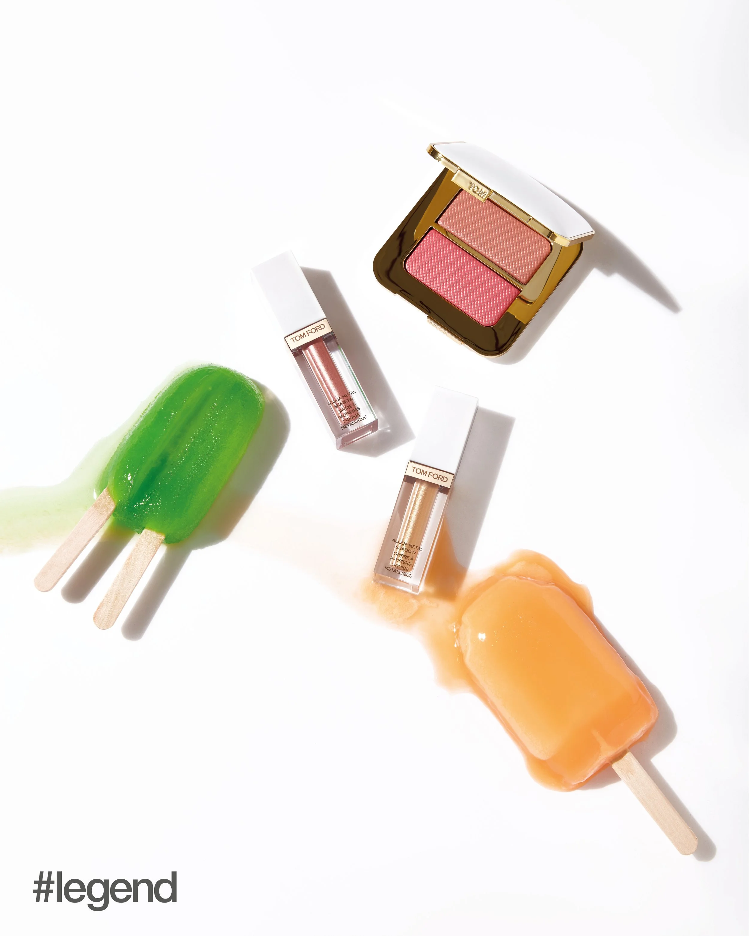 The image displays three popsicles: two vibrant green popsicles on the left, a peach-colored popsicle on the right, and an orange popsicle slightly below the peach one, all arranged on a white background. Additionally, there are two boxes of Tom Ford