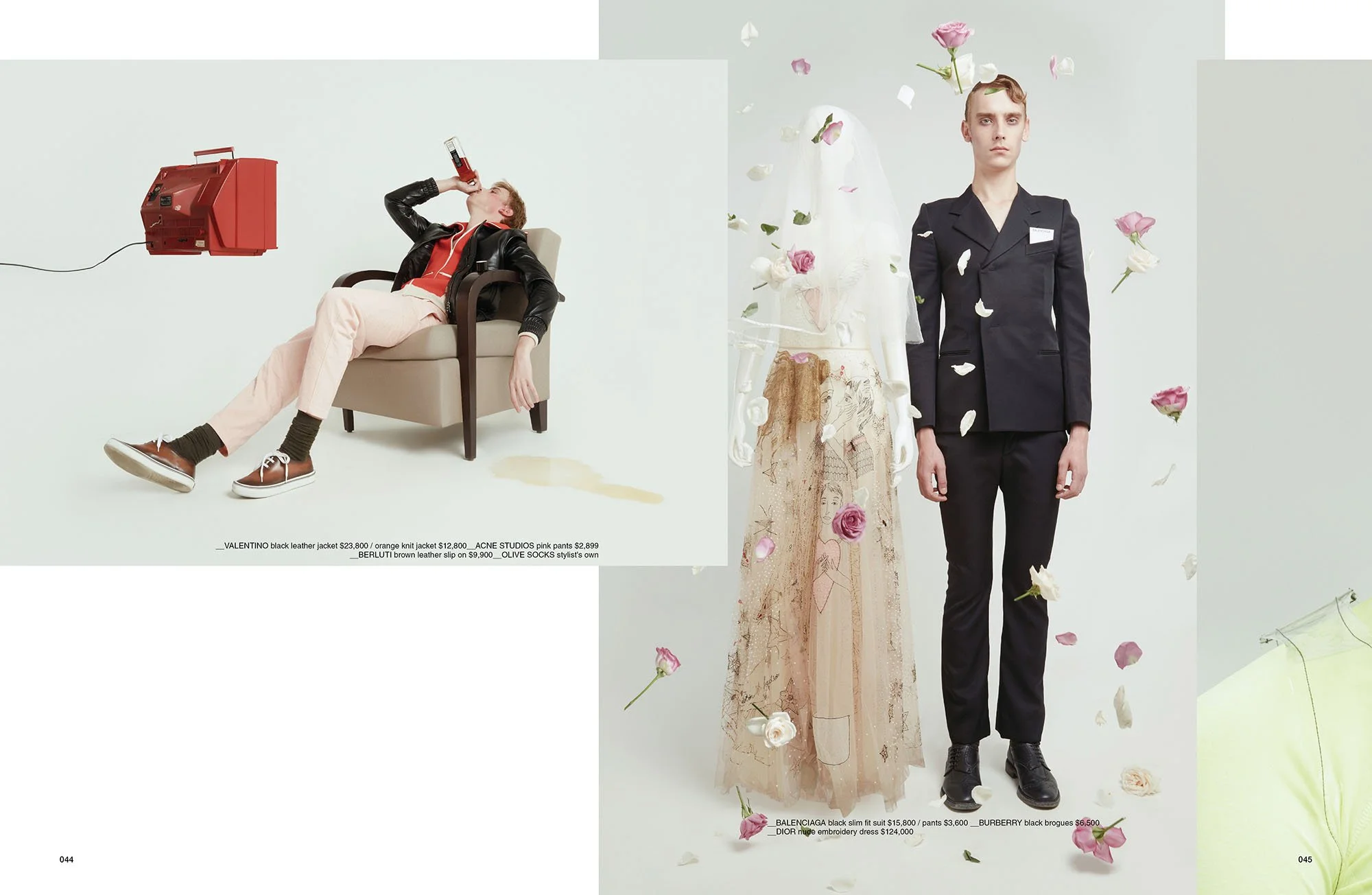 Two fashion models posing against a plain background, one dressed in dark formal attire with flower petals floating around, and the other sitting in a chair and drinking from a bottle, with a red telephone mounted on the wall and a faintly spilled li