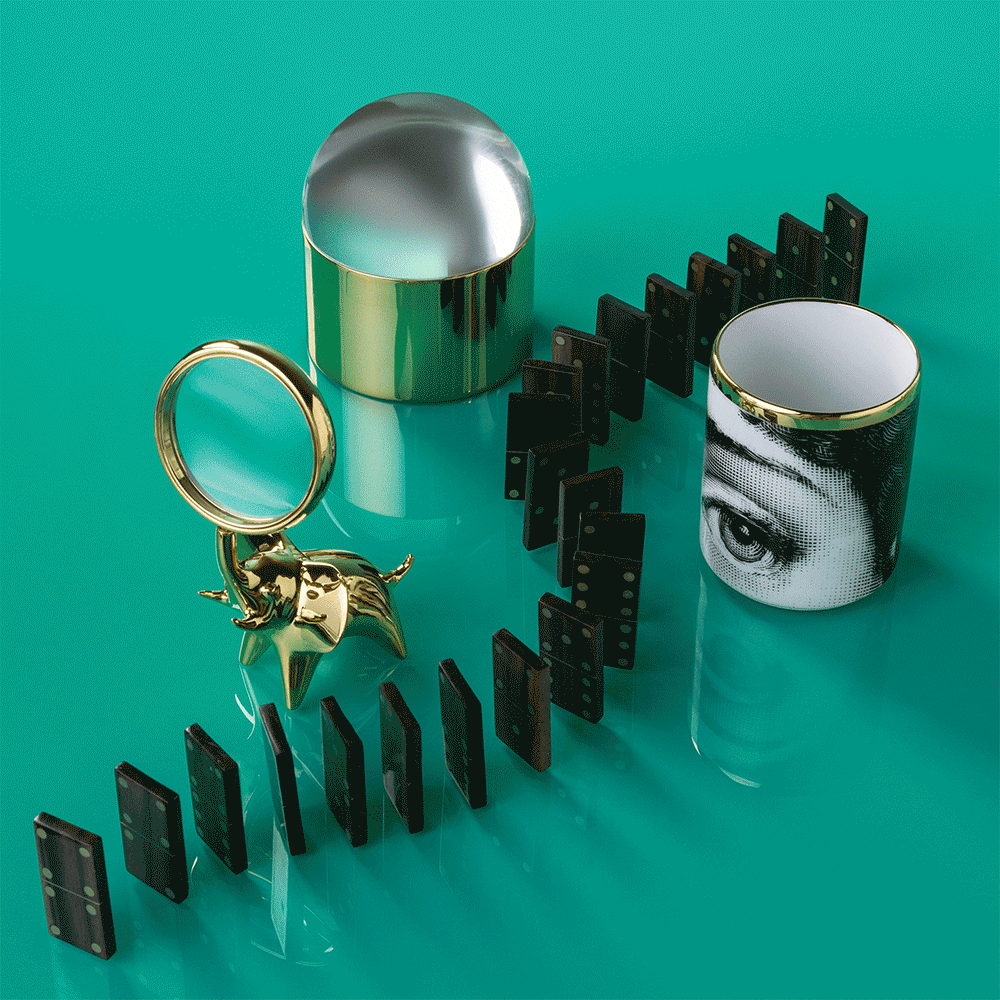 Dominoes falling in a chain, with a magnifying glass featuring a gold dog handle, copper and silver containers, and a mug with a black-and-white eye design on it, set against a turquoise background.