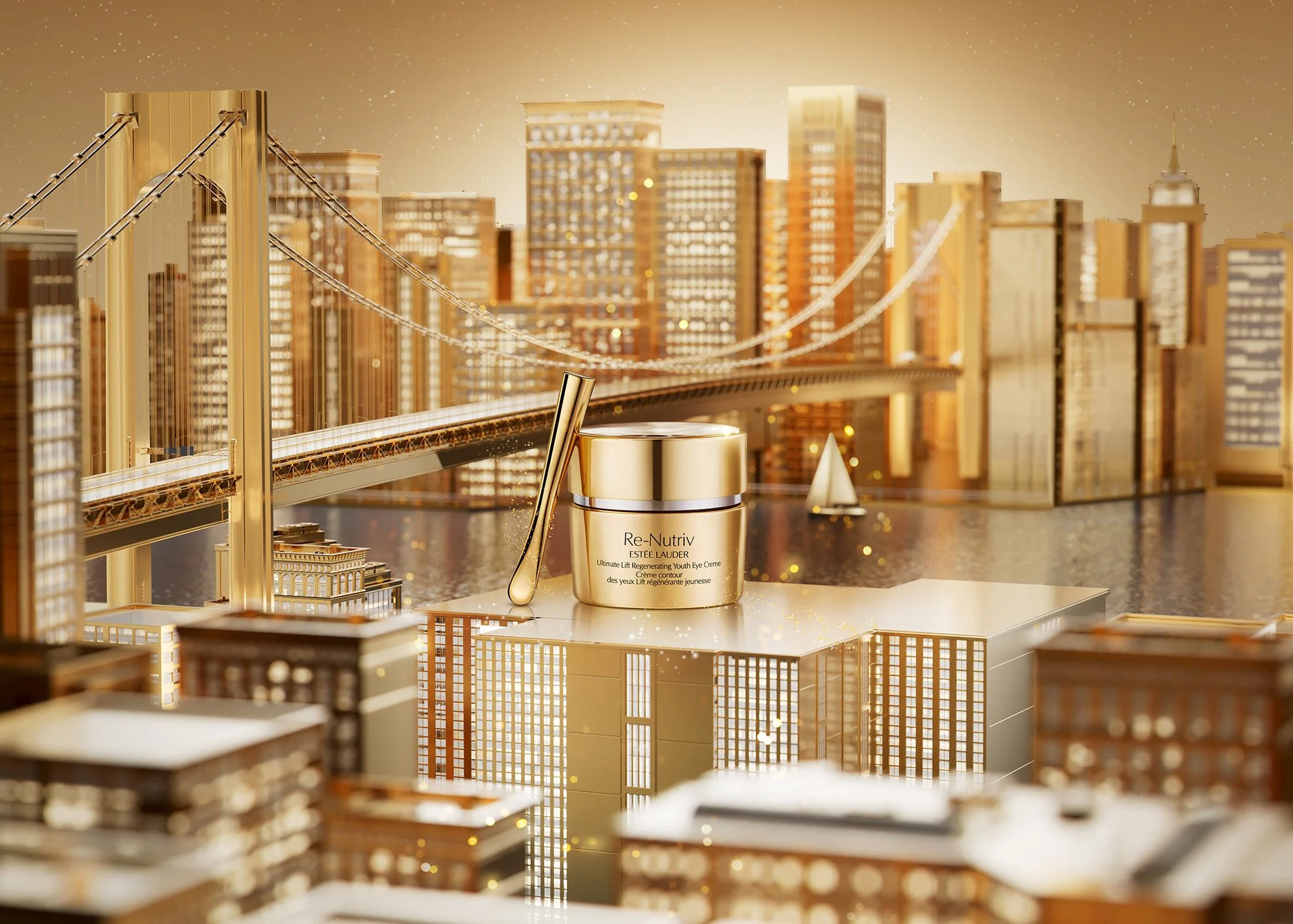 A gold-colored jar of Estée Lauder Re-Nutriv skincare product, with a small gold spatula leaning against it, set against a detailed miniature cityscape featuring tall buildings, a bridge, and a river with a sailboat. The scene is illuminated with war