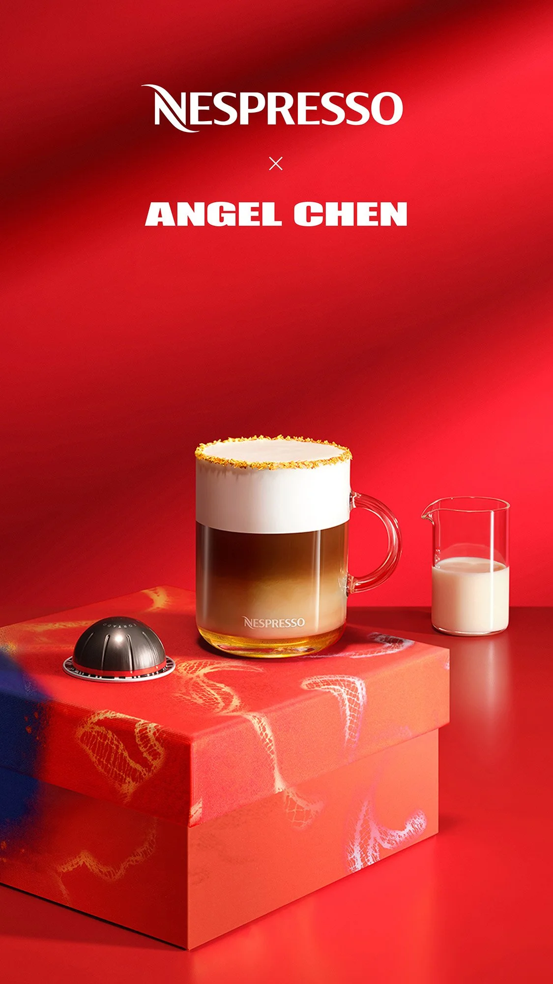 A glass mug of layered coffee with foam on top, a small pitcher of milk, and a Nespresso coffee capsule on a red box, with a red background featuring the Nespresso logo and the name Angel Chen.
