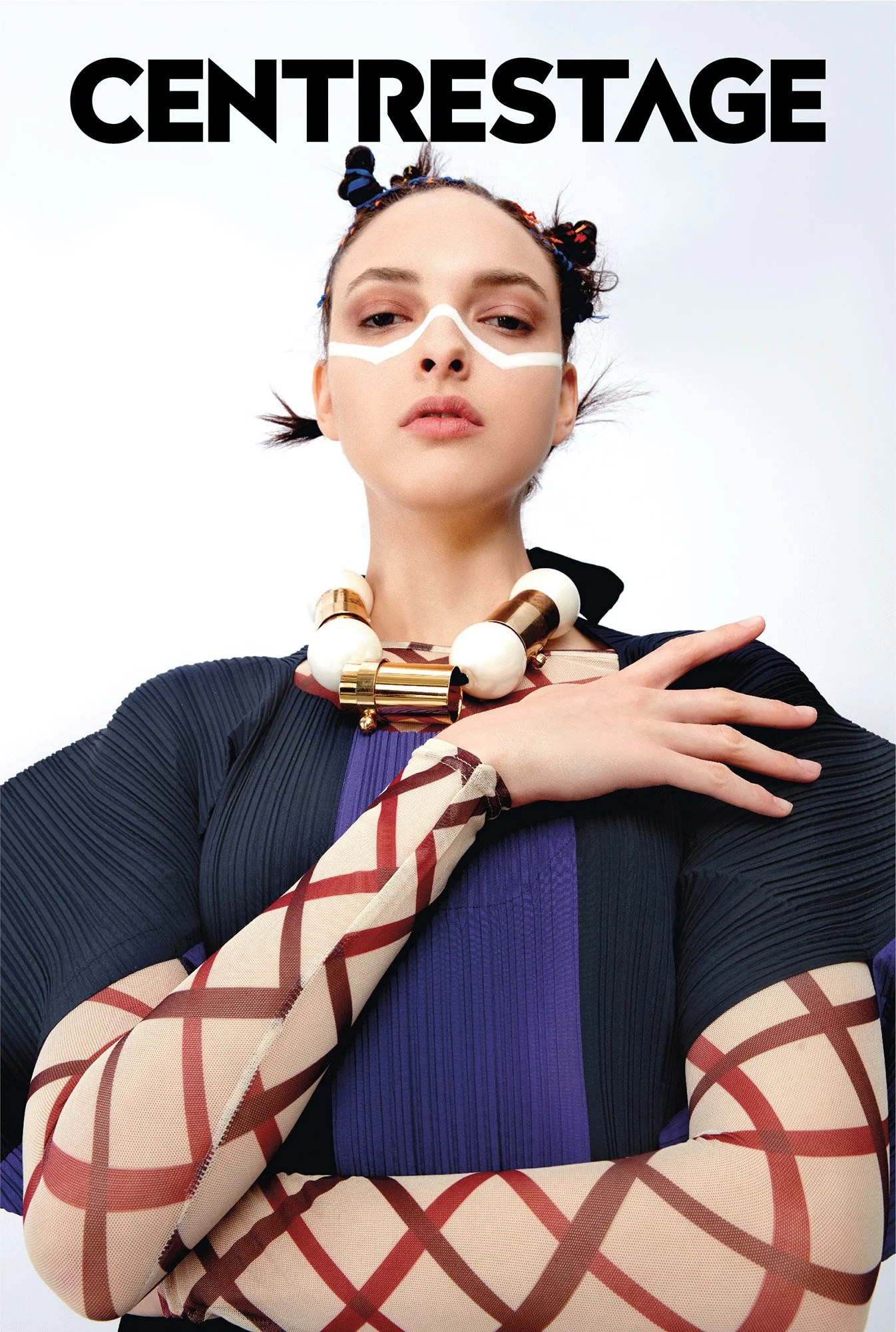 Fashion model with makeup and accessories, wearing a black and purple outfit, and a chunky necklace, posing against a white background with the word 'CENTRESTAGE' at the top.