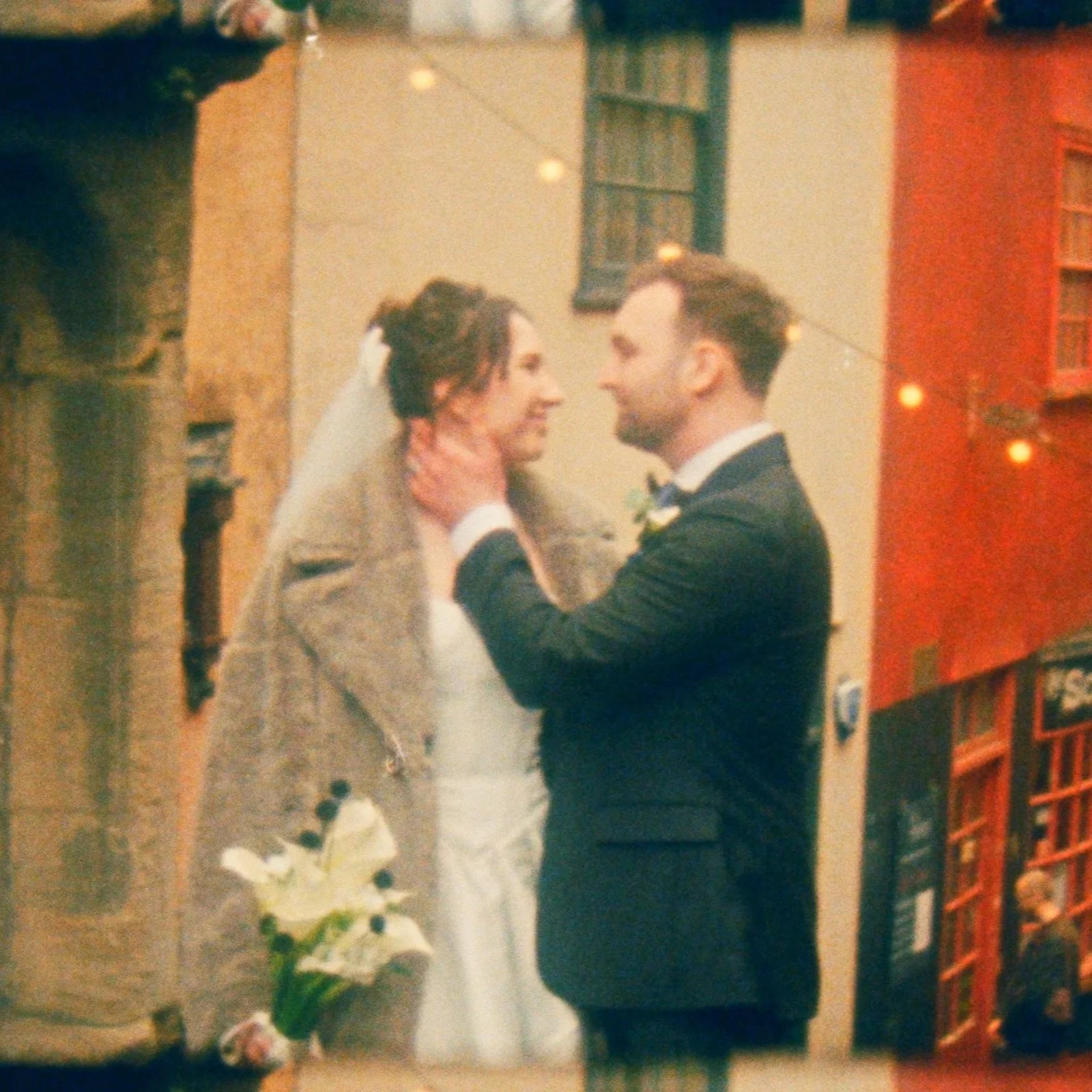 A bride and groom sharing a moment during their wedding ceremony outdoors.