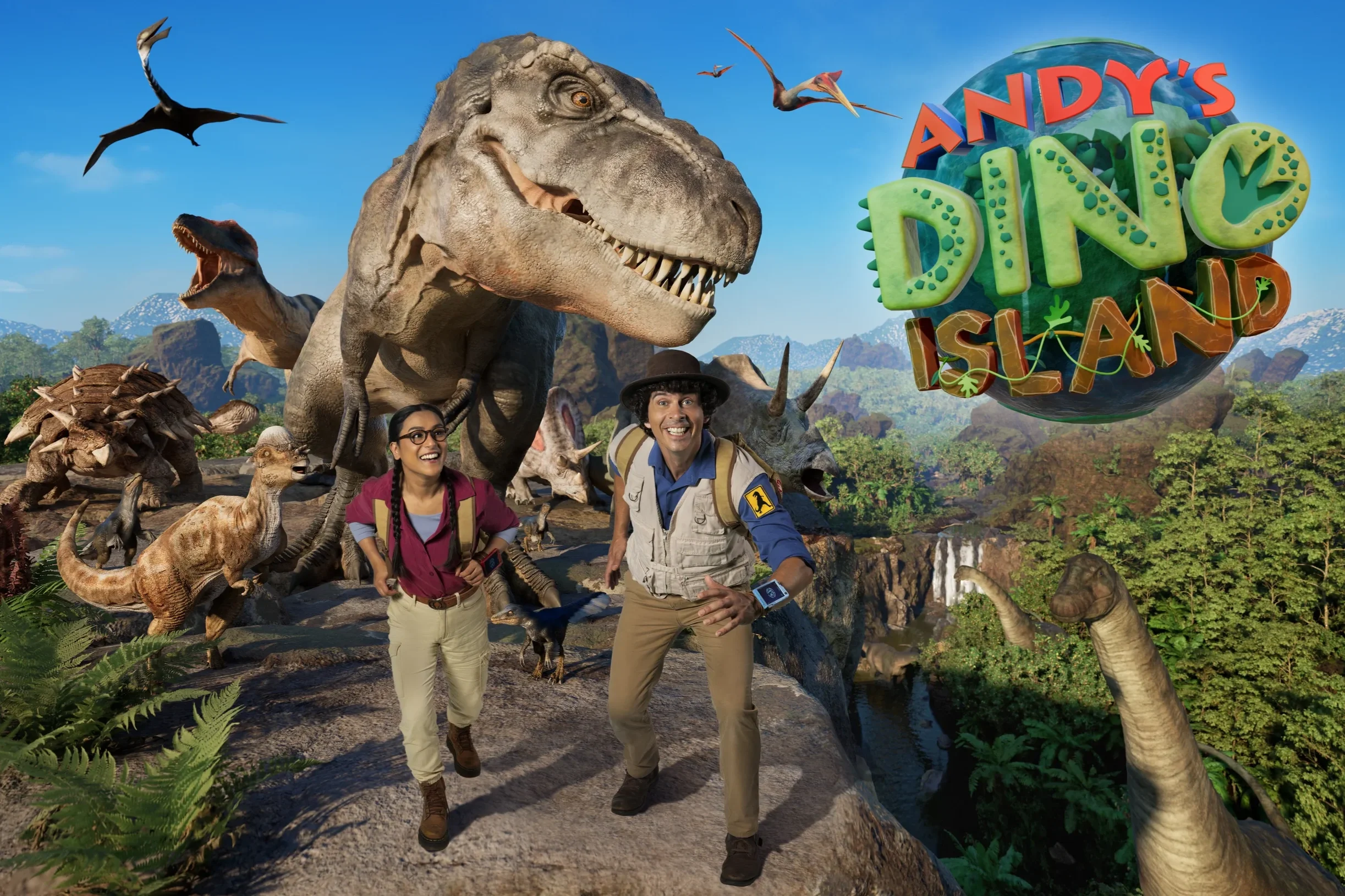 Two people, a woman and a man, smiling and running in a dinosaur-themed amusement park called Andy's Dino Island. The background features large dinosaurs, lush greenery, and a blue sky.