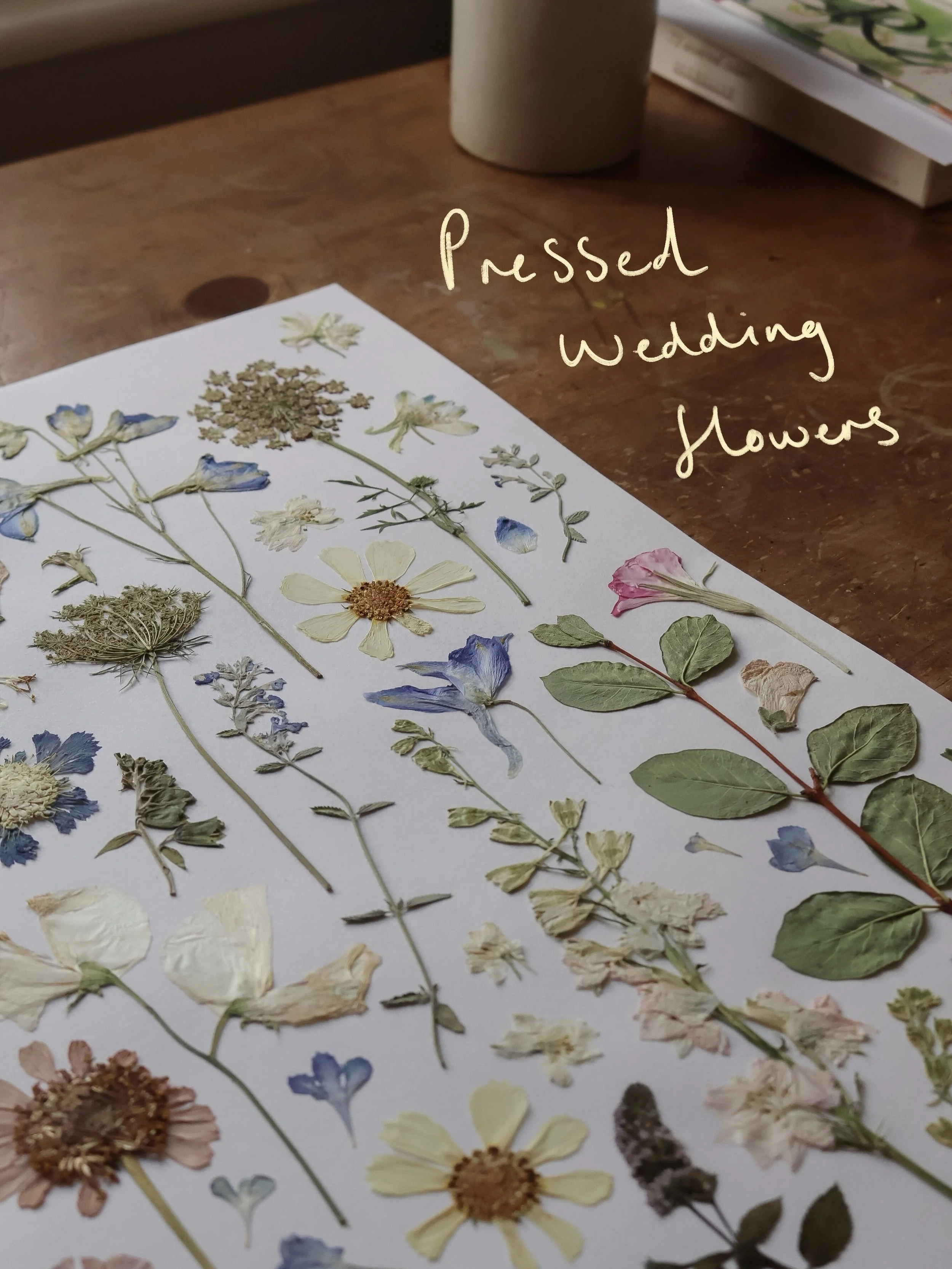 One of Millys pressed flower pieces from her August wedding 🌿