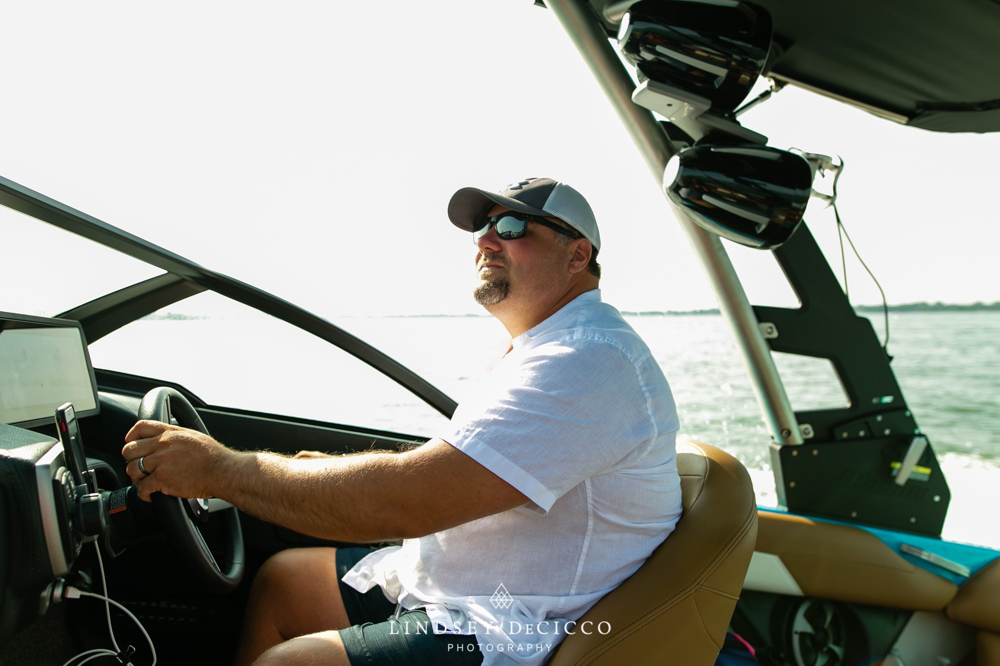 Dad Driving the Boat with Family on Board at Lake Wawasee