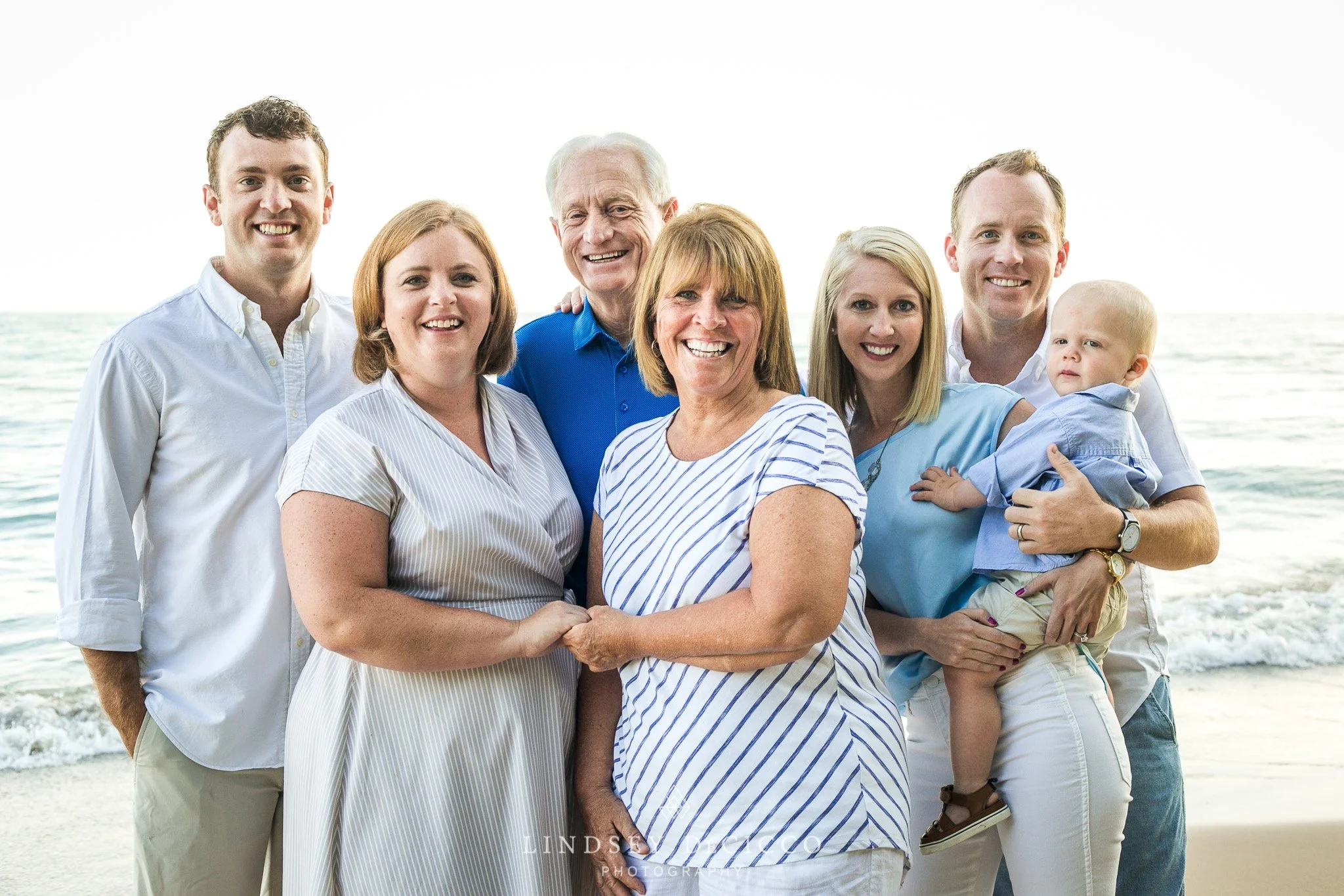 Close-up of the family with the baby on the beach