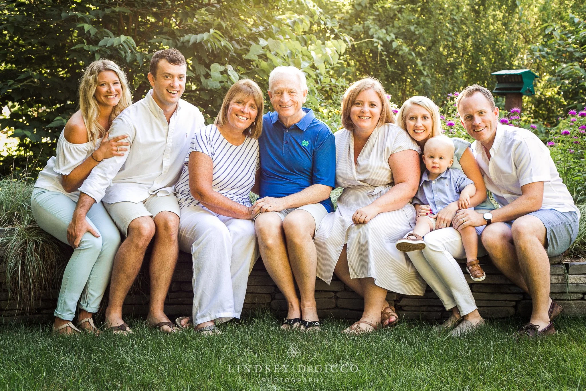 Family group portrait in a lush garden