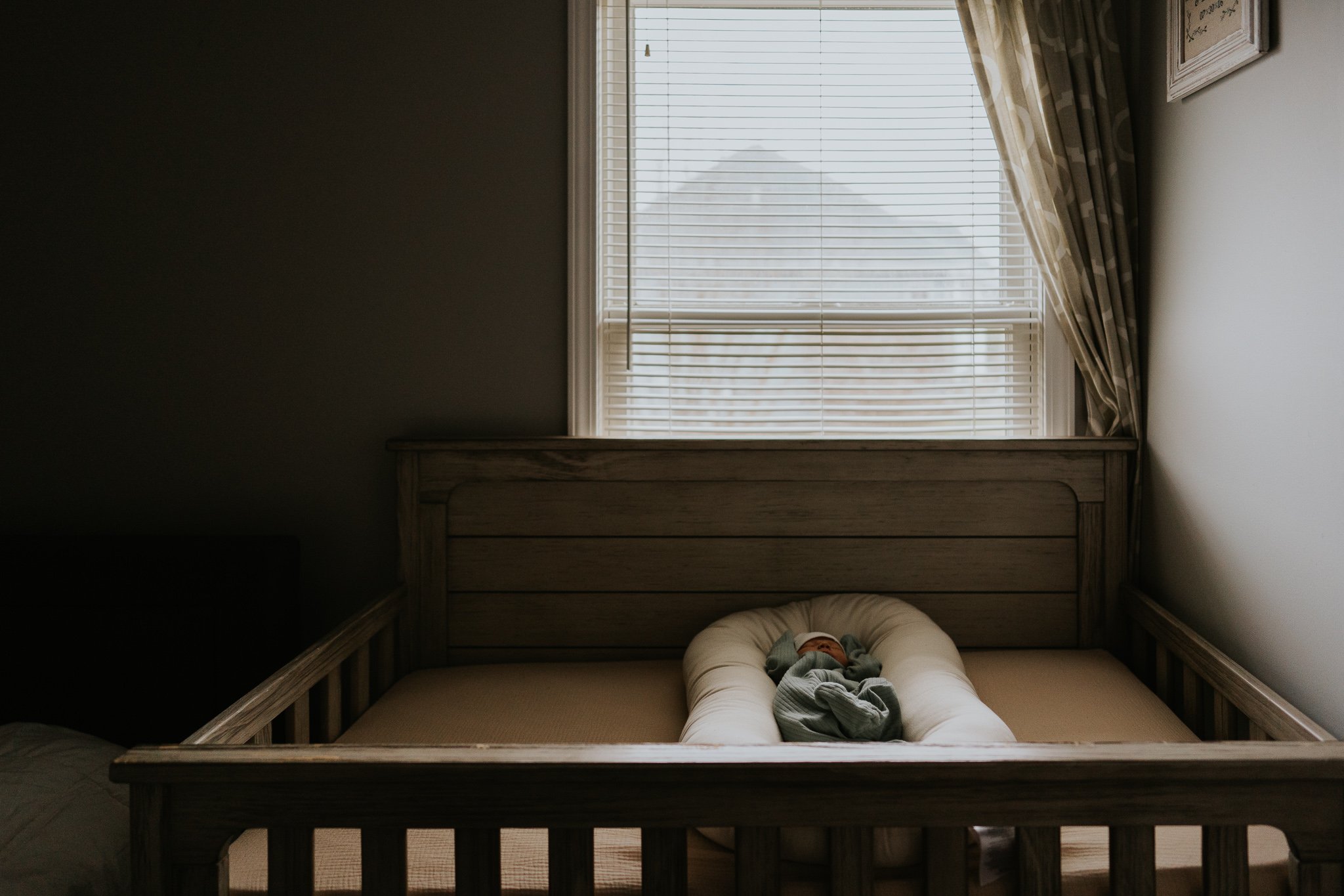 Newborn lying in a crib