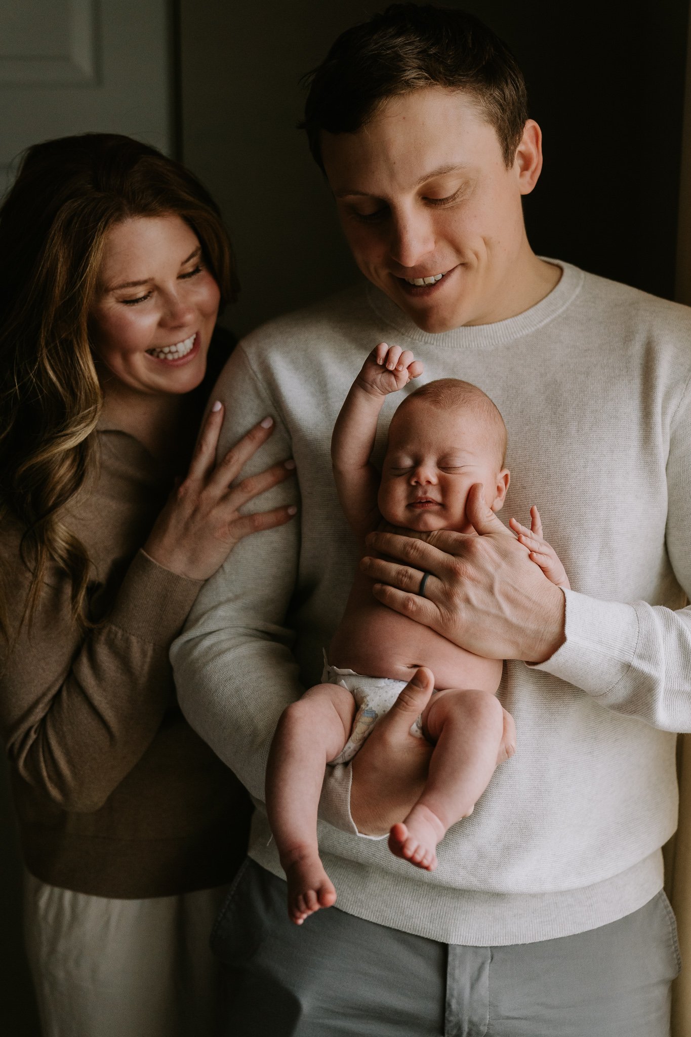 baby raises arm in power gesture