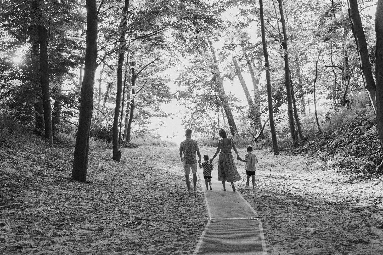 Family Walking Through the Woods of Berrien Street Beach