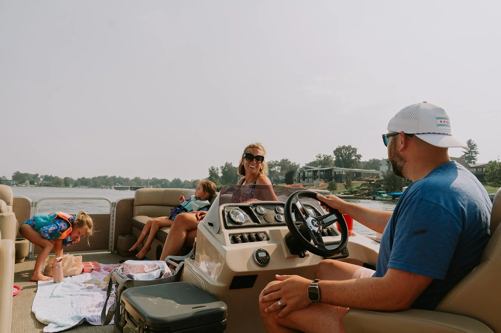 family-boat-pontoon-driving-baldwin-lake