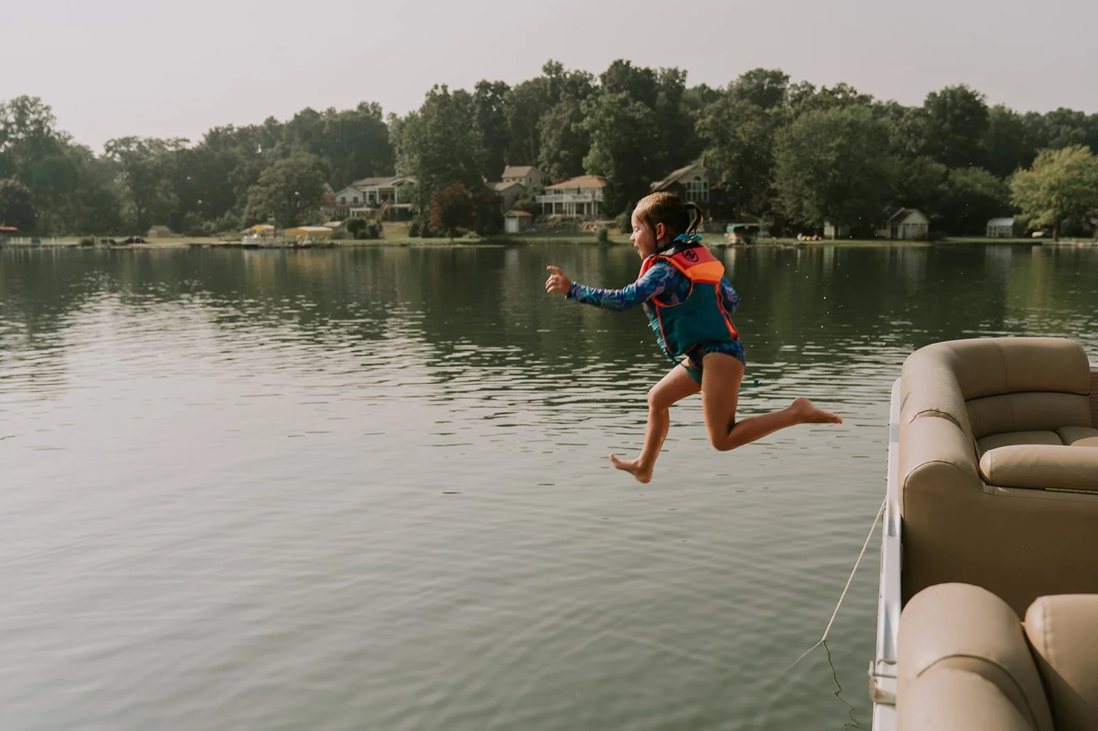 girl-jumping-into-water-baldwin-lake