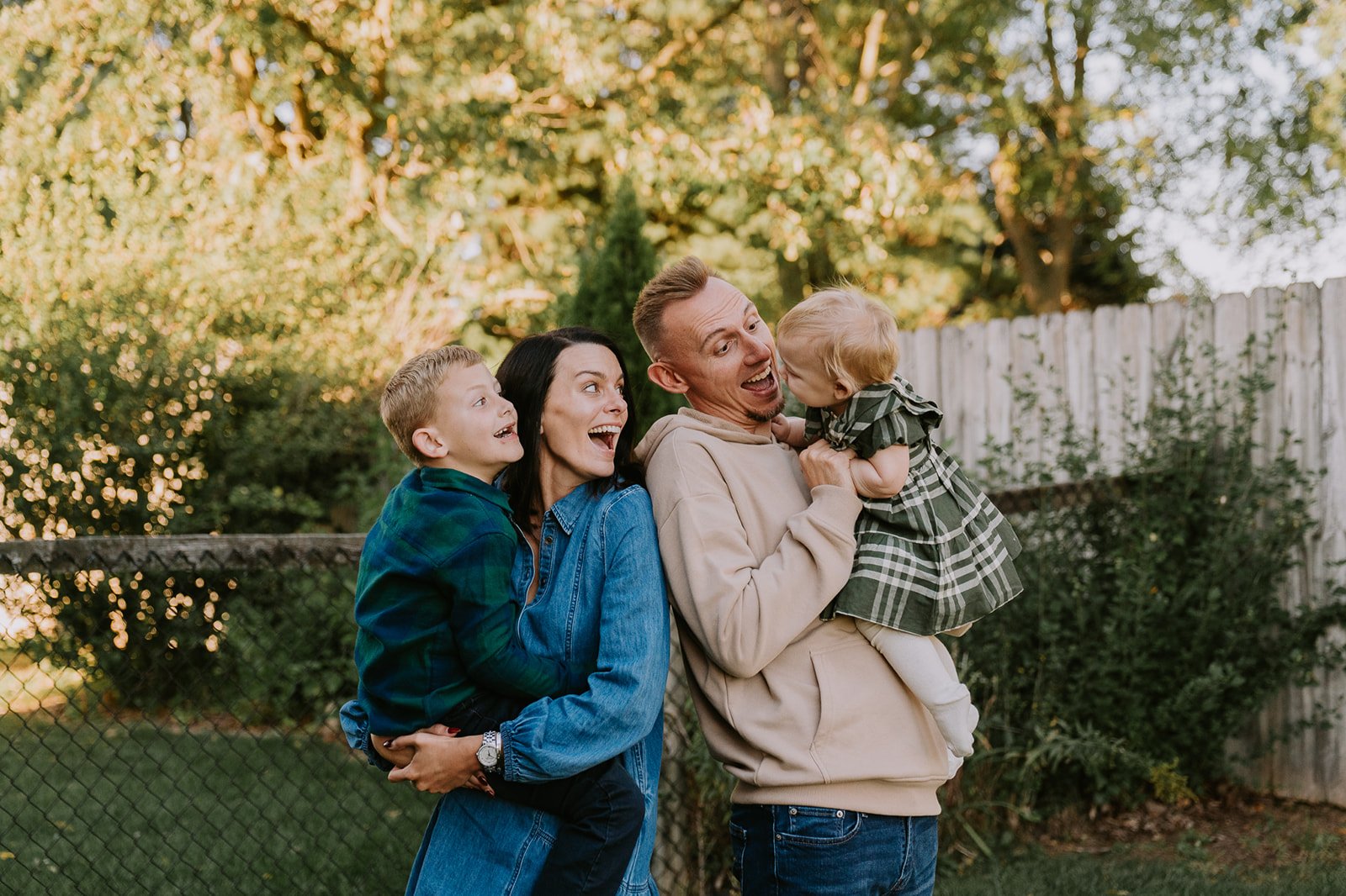 Parents Lifting Toddler in the Yard | Front Porch Minis