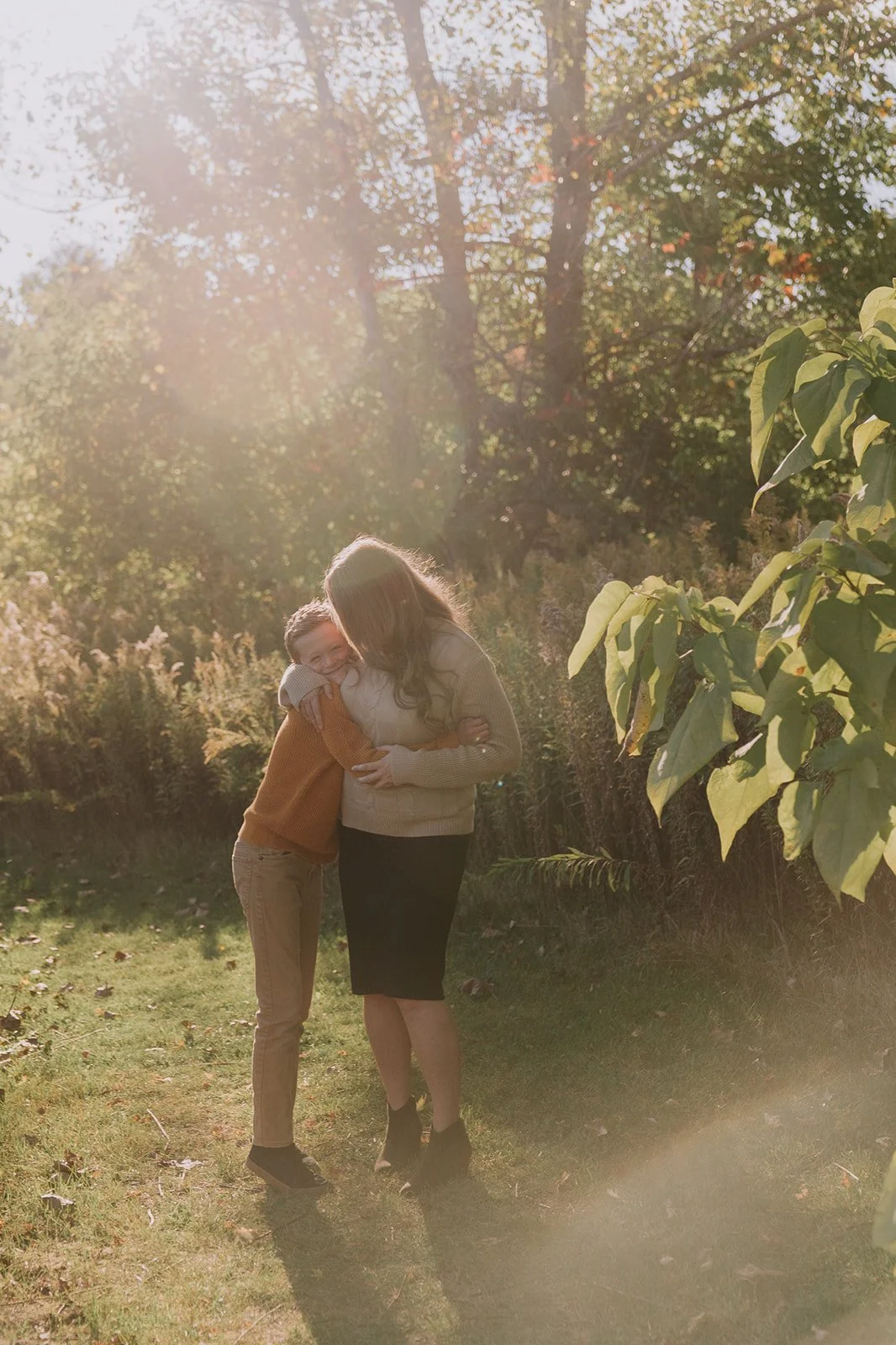 Sun-Soaked Hug in the Meadow | Fall Family Mini Sessions Indiana