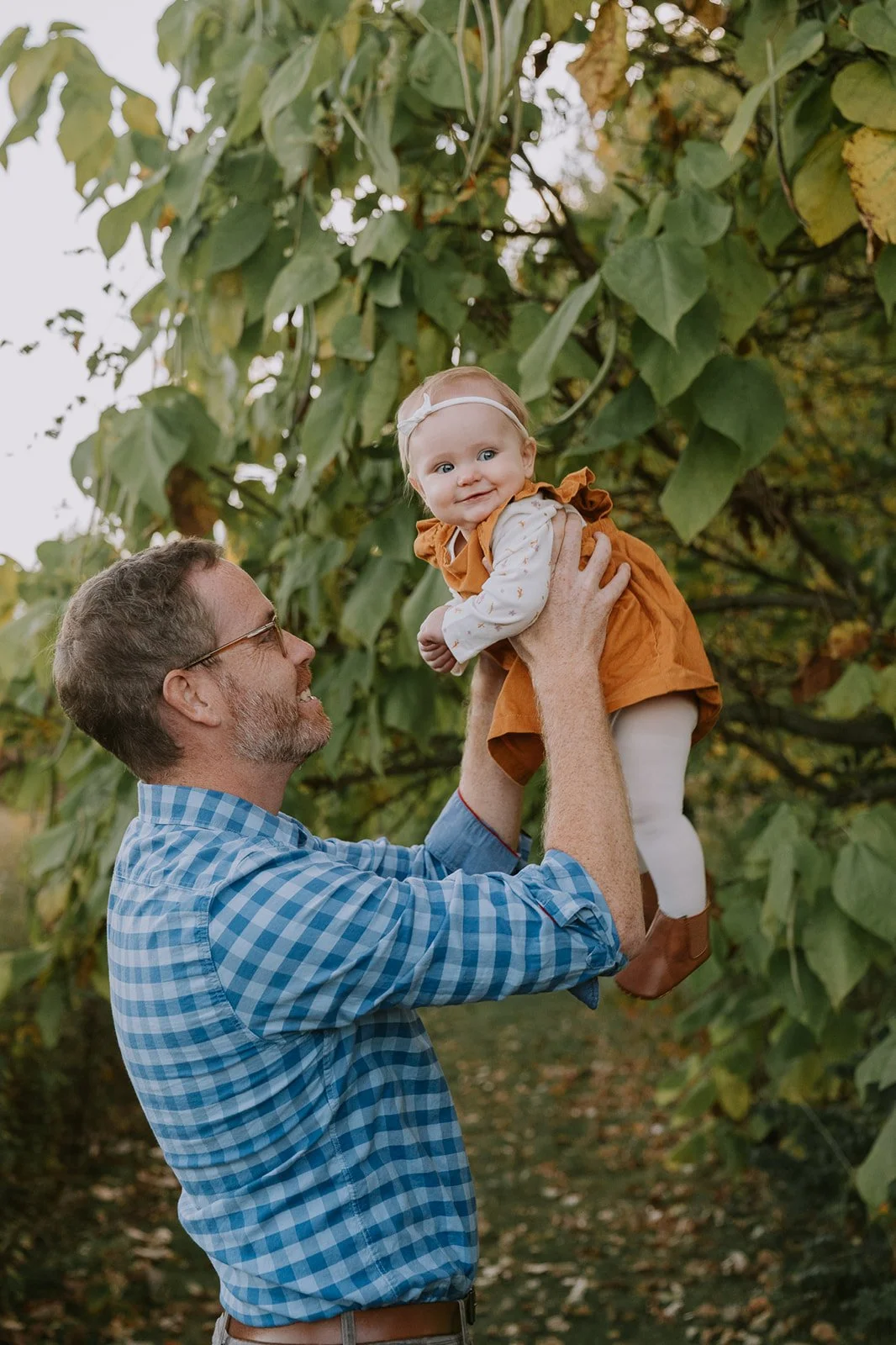 Dad Lifting Baby in the Meadow | Fall Mini Sessions Indiana