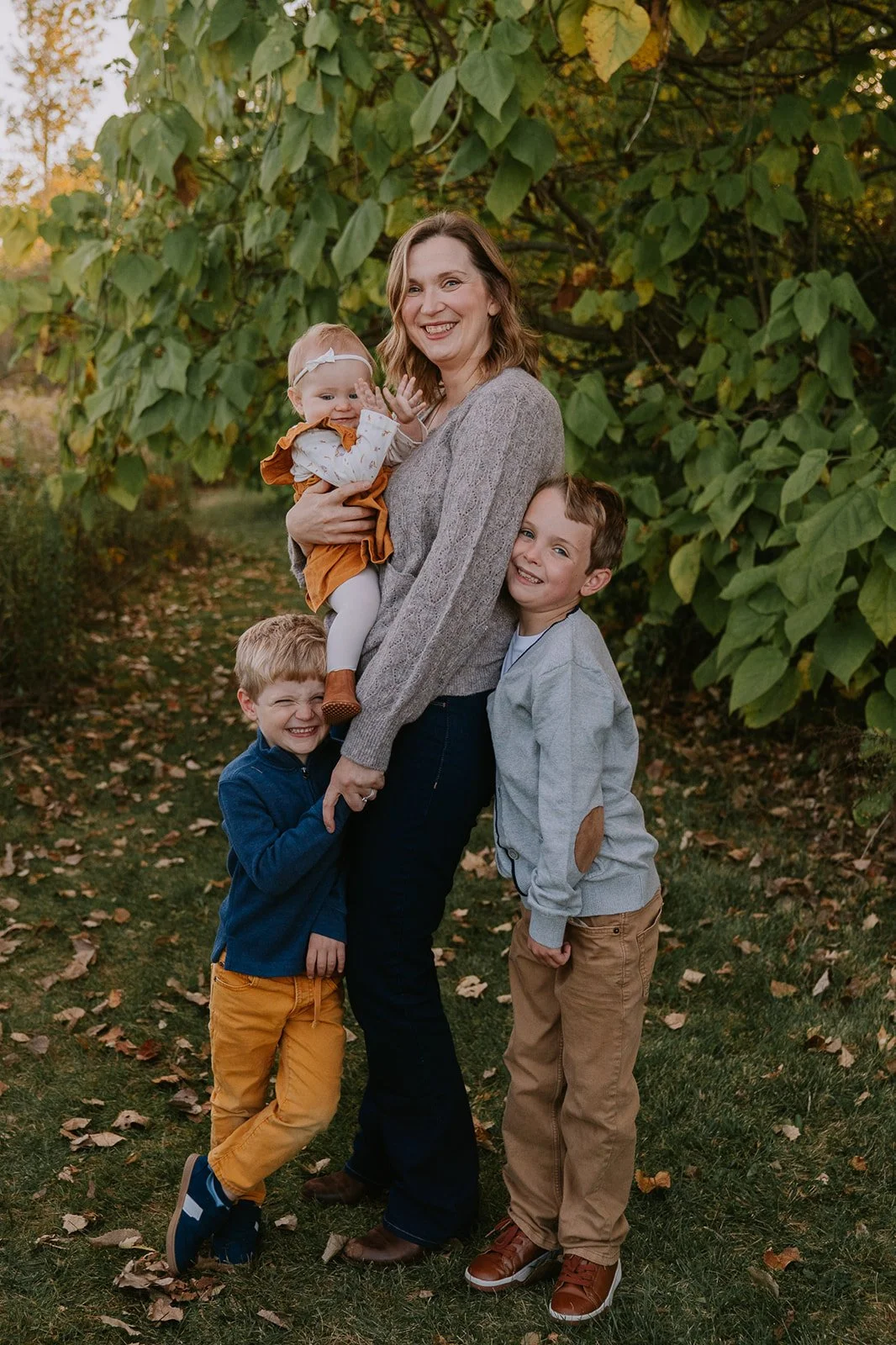 Laughing Family Portrait in Meadow | Family Mini Sessions Indiana