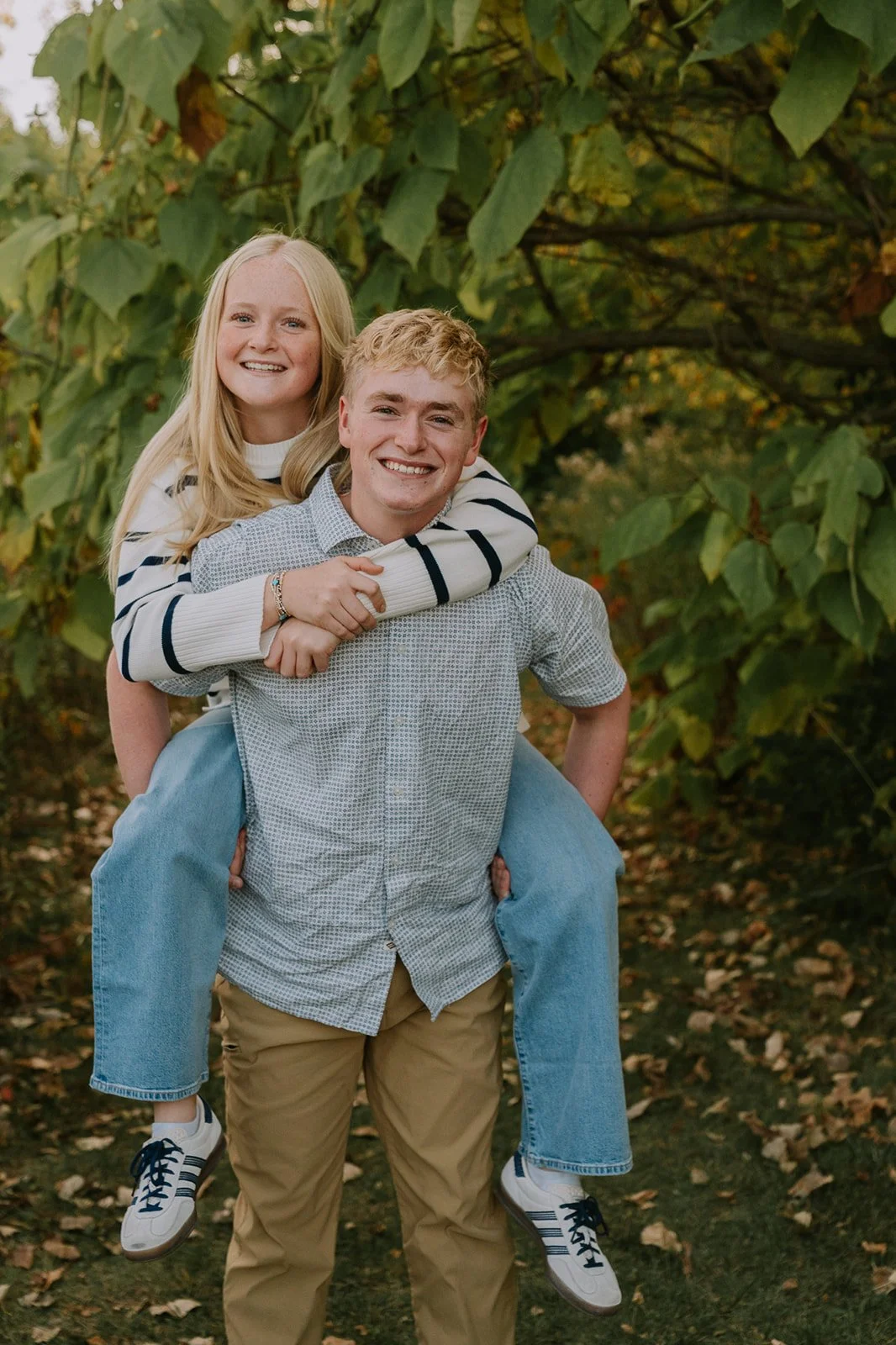Siblings Laughing in Autumn Meadow | Mishawaka Indiana Photographer