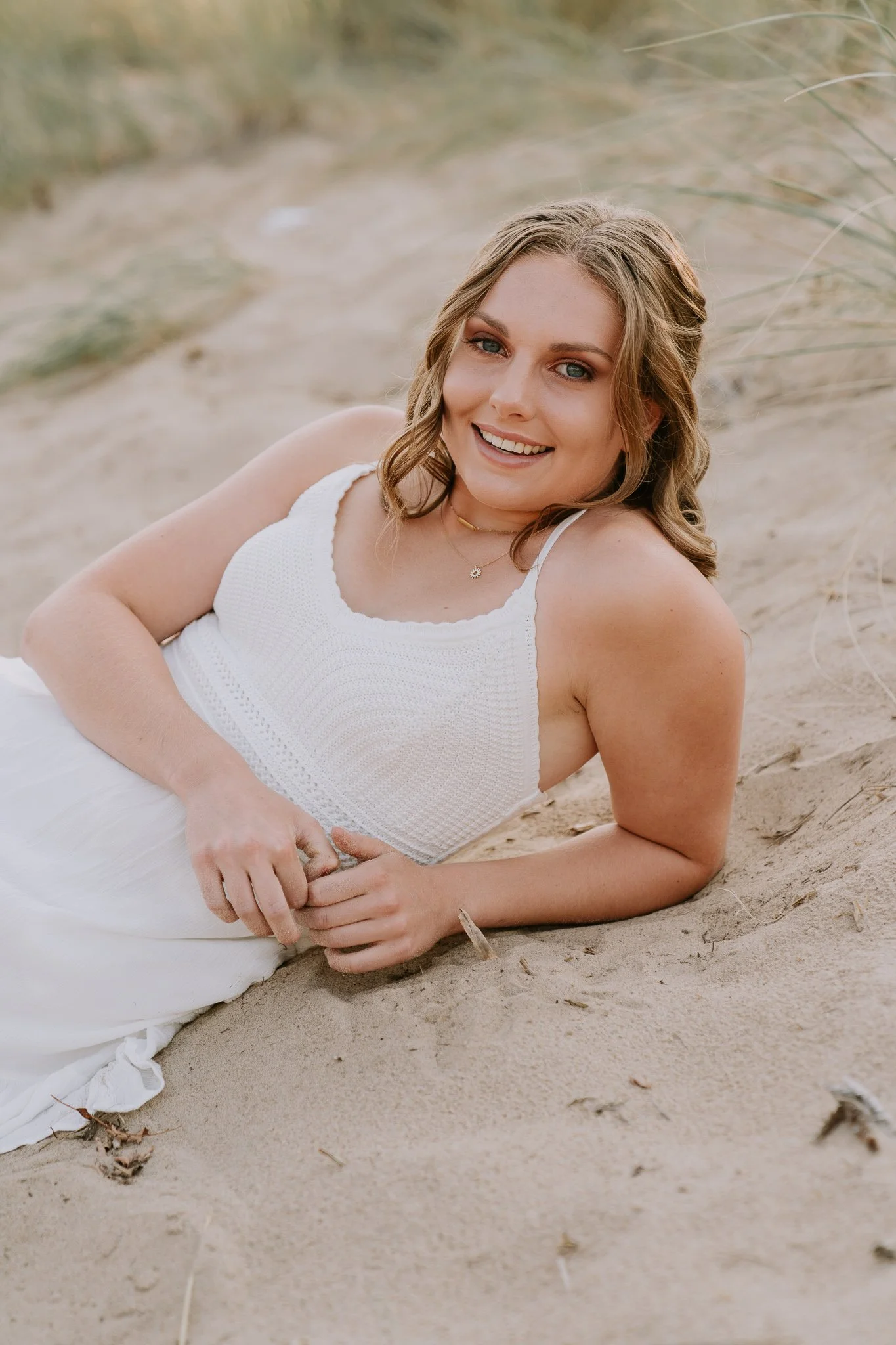 Seated dune grass senior pictures